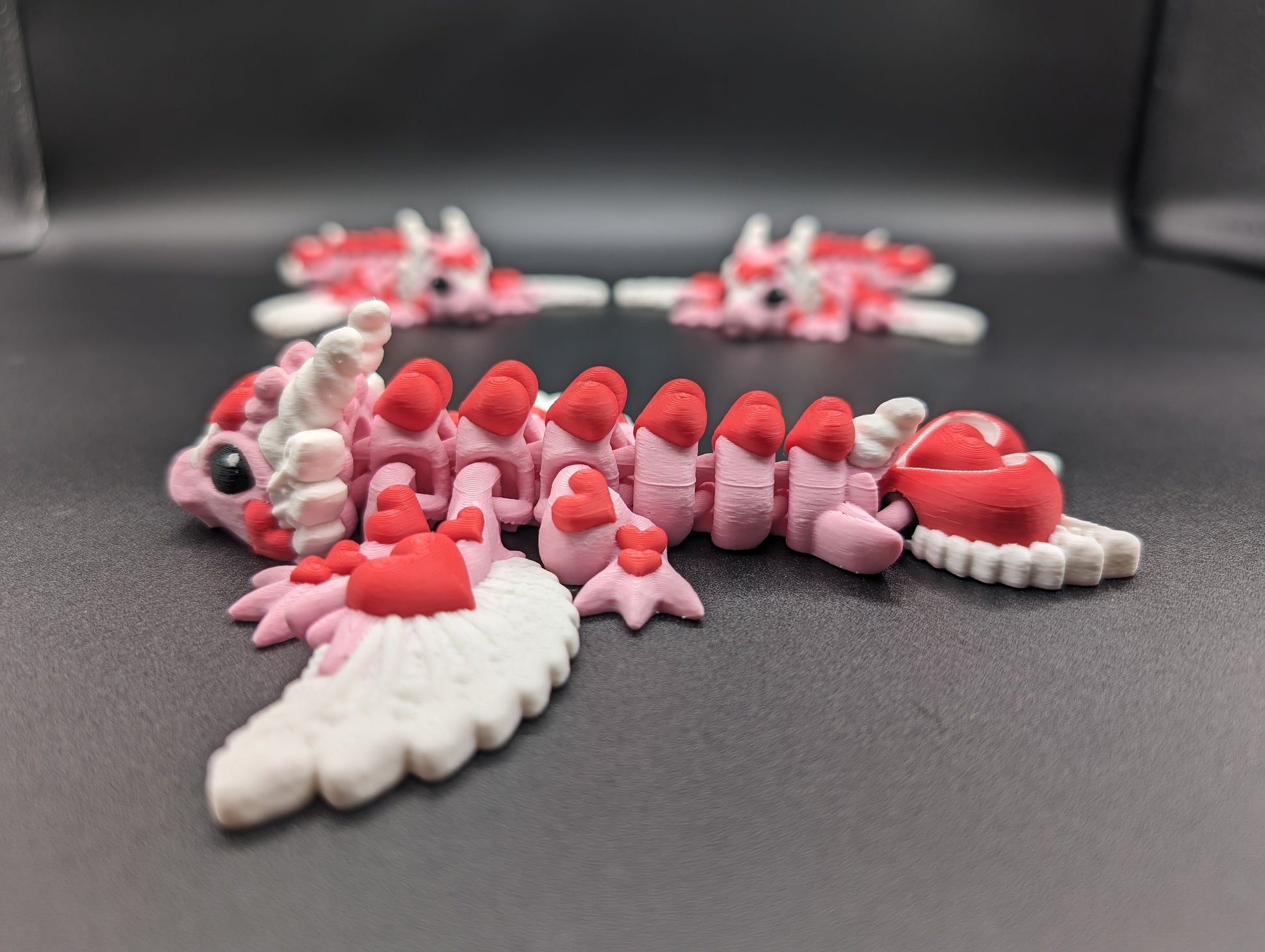 Discover the magic of our Valentine Heart Dragon! This enchanting articulating dragon not only graces your bookshelf with whimsy but also makes for a heartfelt and unforgettable Valentine's Day gift.
