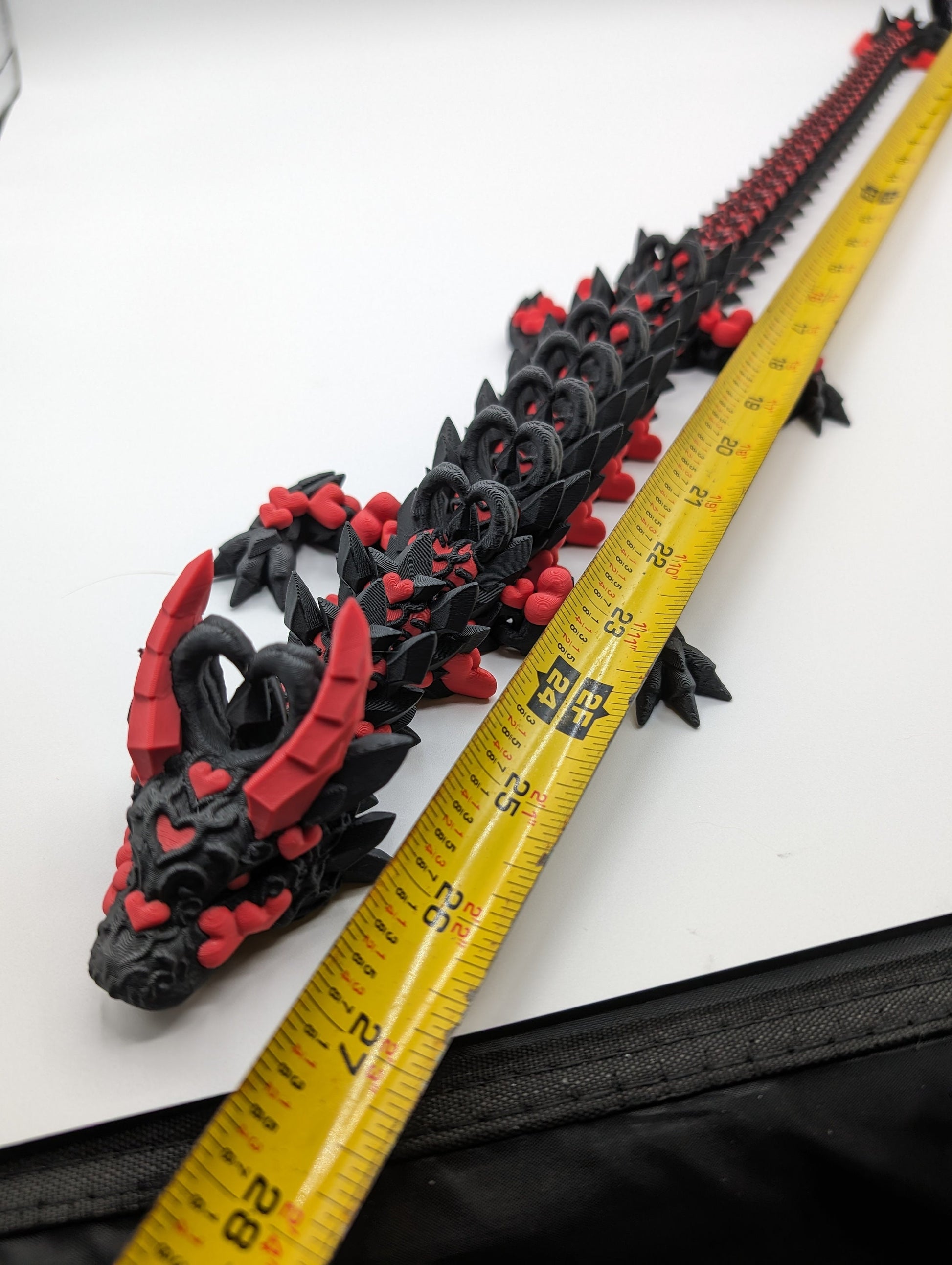 Discover the magic of our Valentine Heart Dragon! This enchanting articulating dragon not only graces your bookshelf with whimsy but also makes for a heartfelt and unforgettable Valentine's Day gift. Elevate your space with love!