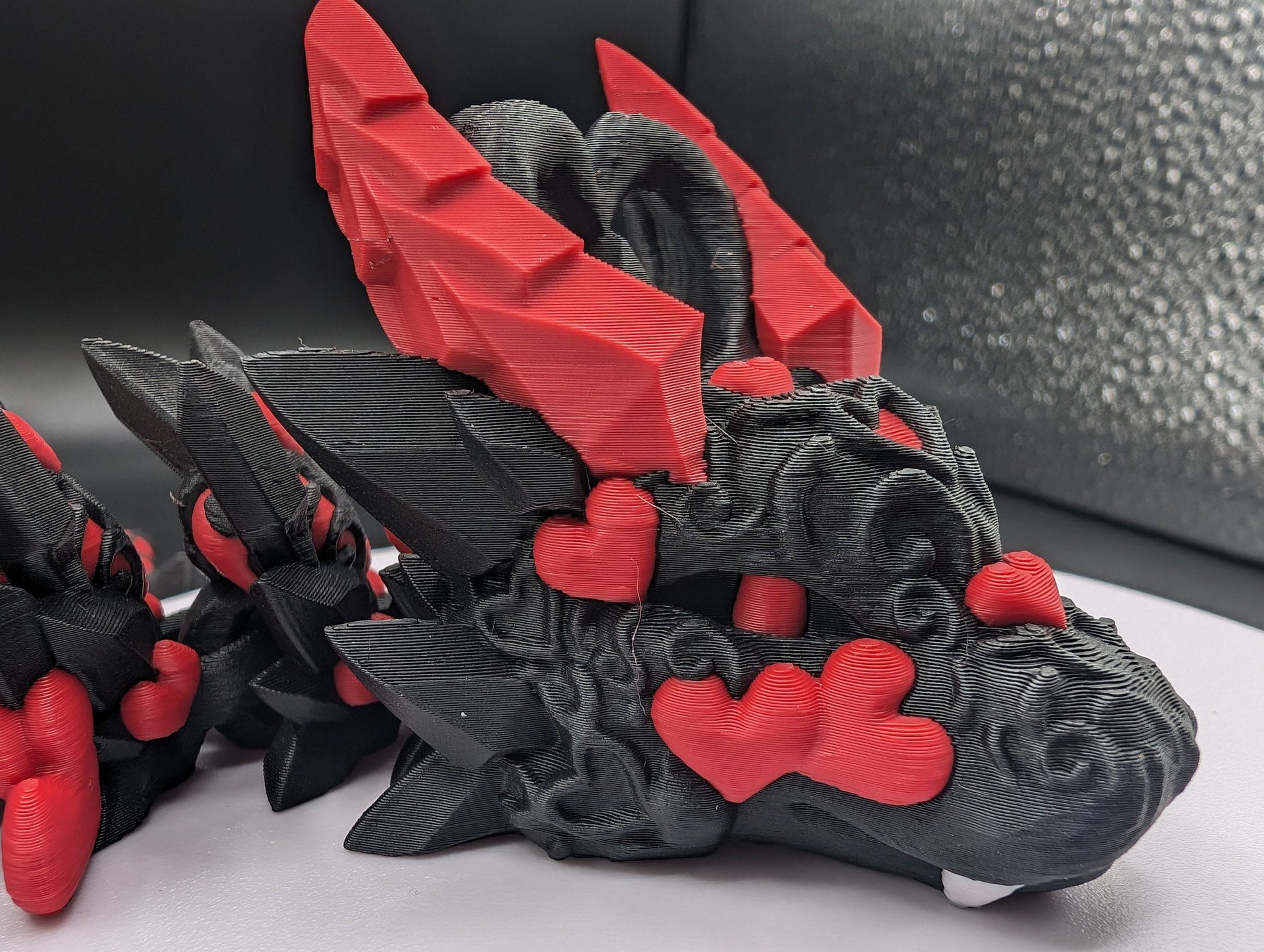 Discover the magic of our Valentine Heart Dragon! This enchanting articulating dragon not only graces your bookshelf with whimsy but also makes for a heartfelt and unforgettable Valentine's Day gift. Elevate your space with love!