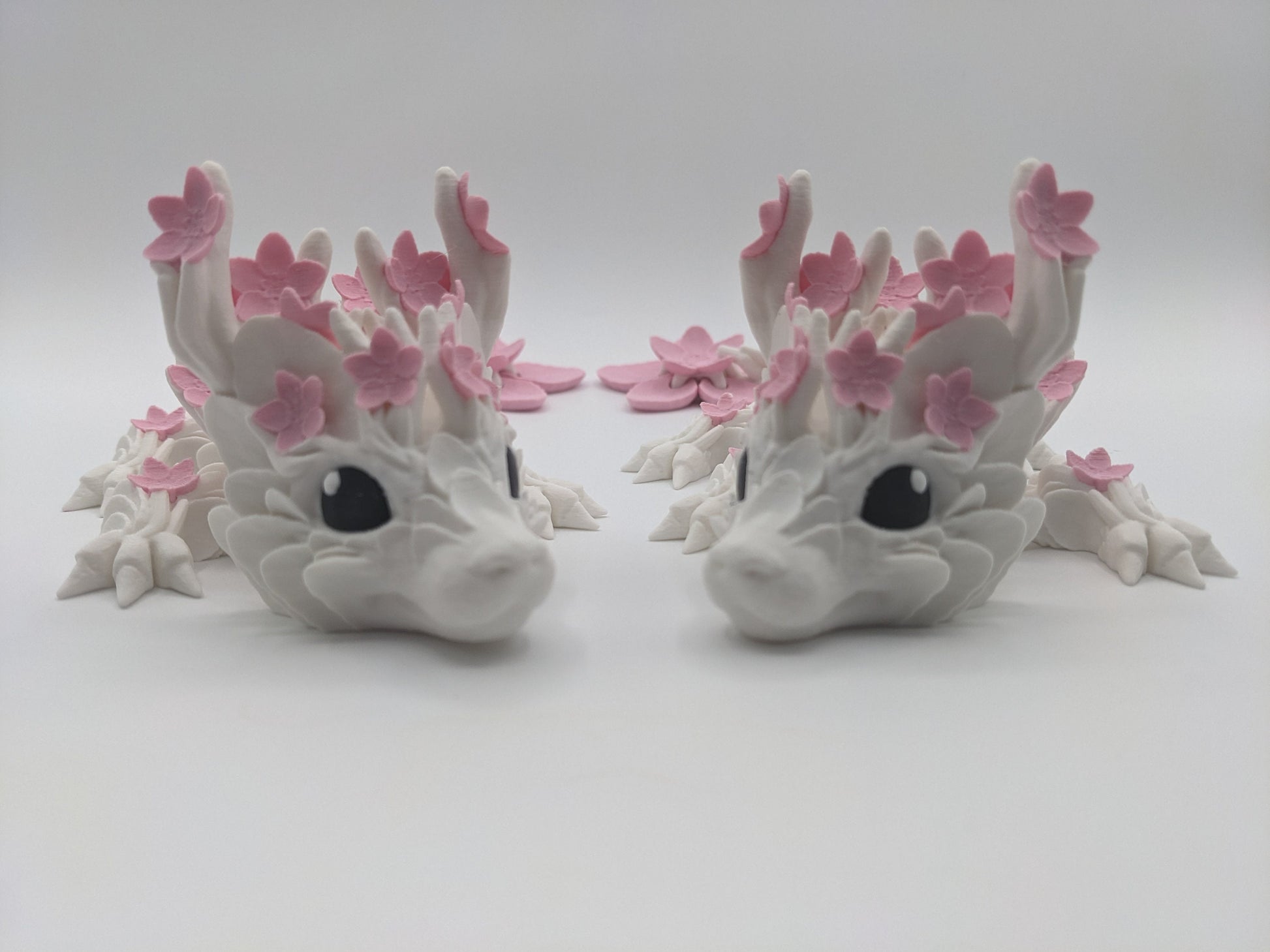 Introducing our Beautiful Articulated Baby Blossom Dragon Fidget Toy, a charming and playful addition to your collection.