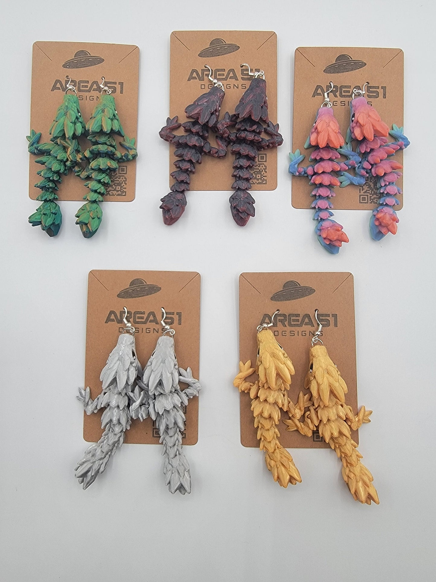 Handcrafted with exquisite detail, these enchanting earrings are the perfect blend of fantasy and elegance, designed to add a touch of whimsy to any outfit. The baby dragon is articulated and moveable.