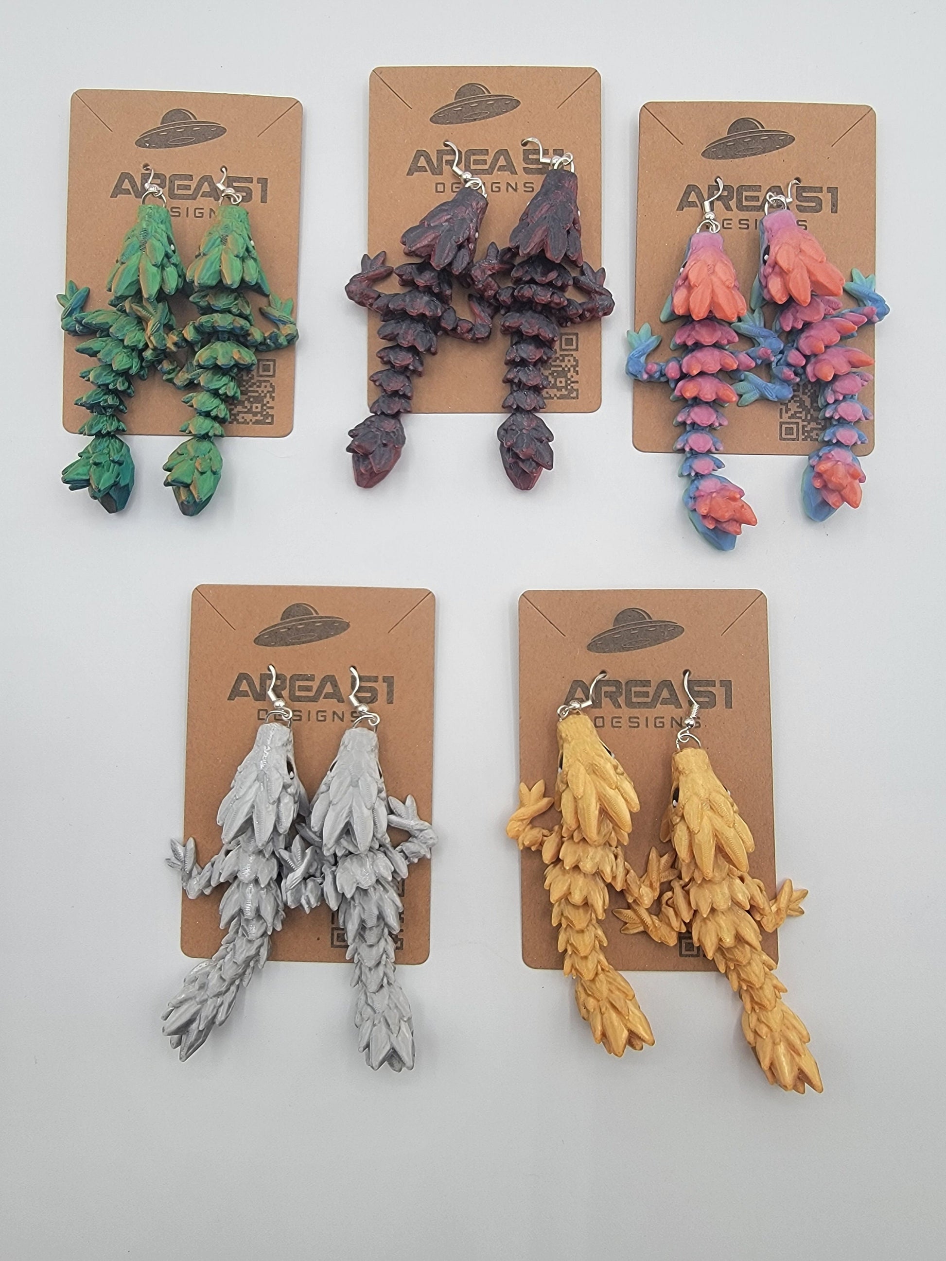 Handcrafted with exquisite detail, these enchanting earrings are the perfect blend of fantasy and elegance, designed to add a touch of whimsy to any outfit. The baby dragon is articulated and moveable.