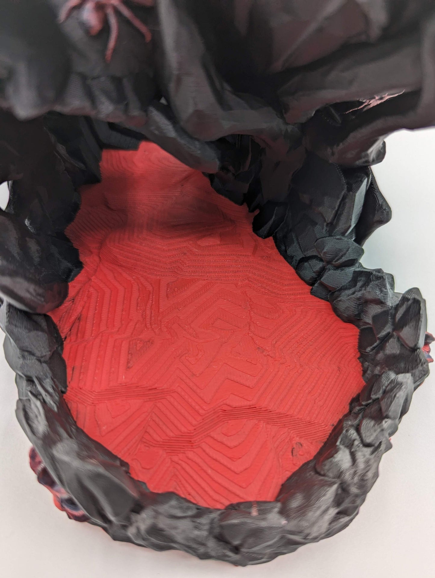 Handcrafted with eerie detail, this 3D printed dice tower combines functionality with a touch of the macabre, making it the perfect addition to any tabletop game. Whether you're a seasoned gamer or a newcomer, this spooky accessory is designed to enhance your gameplay with a chilling twist.