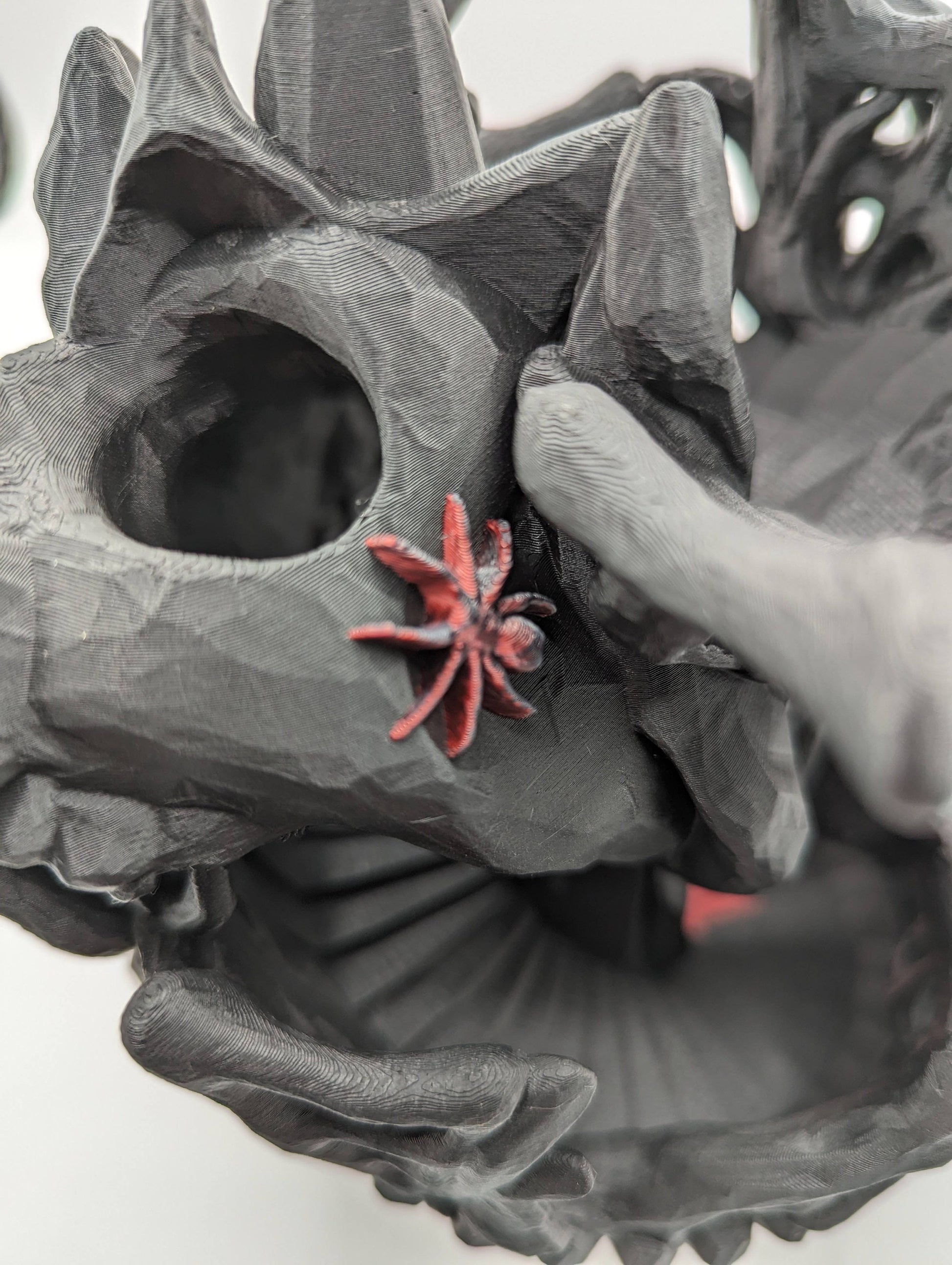 Handcrafted with eerie detail, this 3D printed dice tower combines functionality with a touch of the macabre, making it the perfect addition to any tabletop game. Whether you're a seasoned gamer or a newcomer, this spooky accessory is designed to enhance your gameplay with a chilling twist.