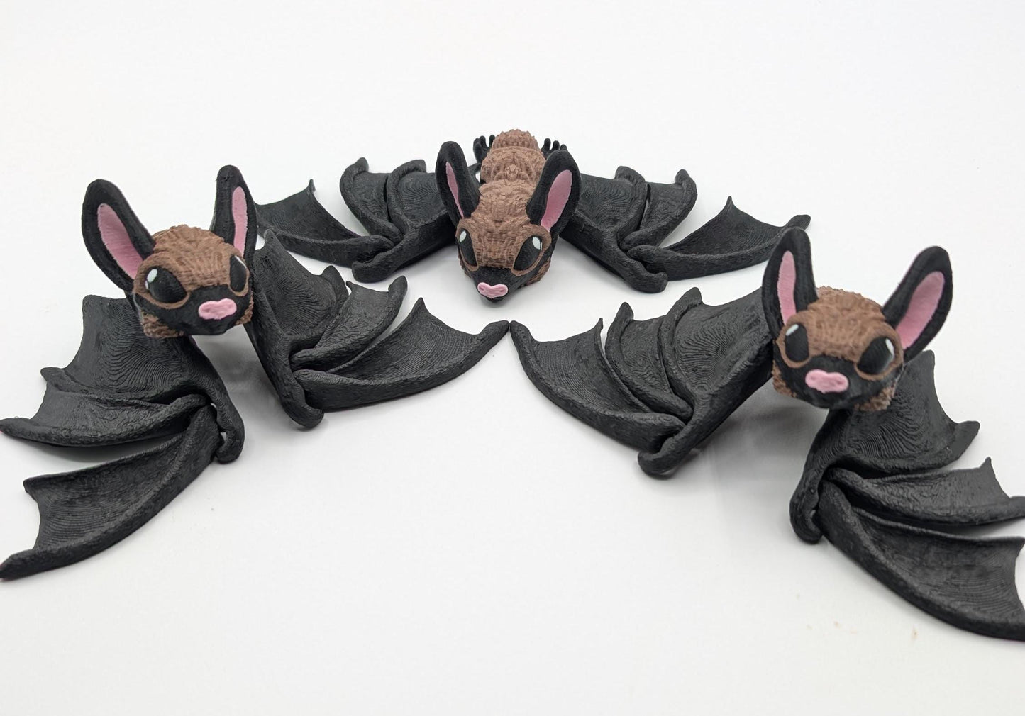 Our Adorable Articulating Bat features fully movable wings & joints, allowing for fun posing & display! Add playful yet spooky presence to any setting.