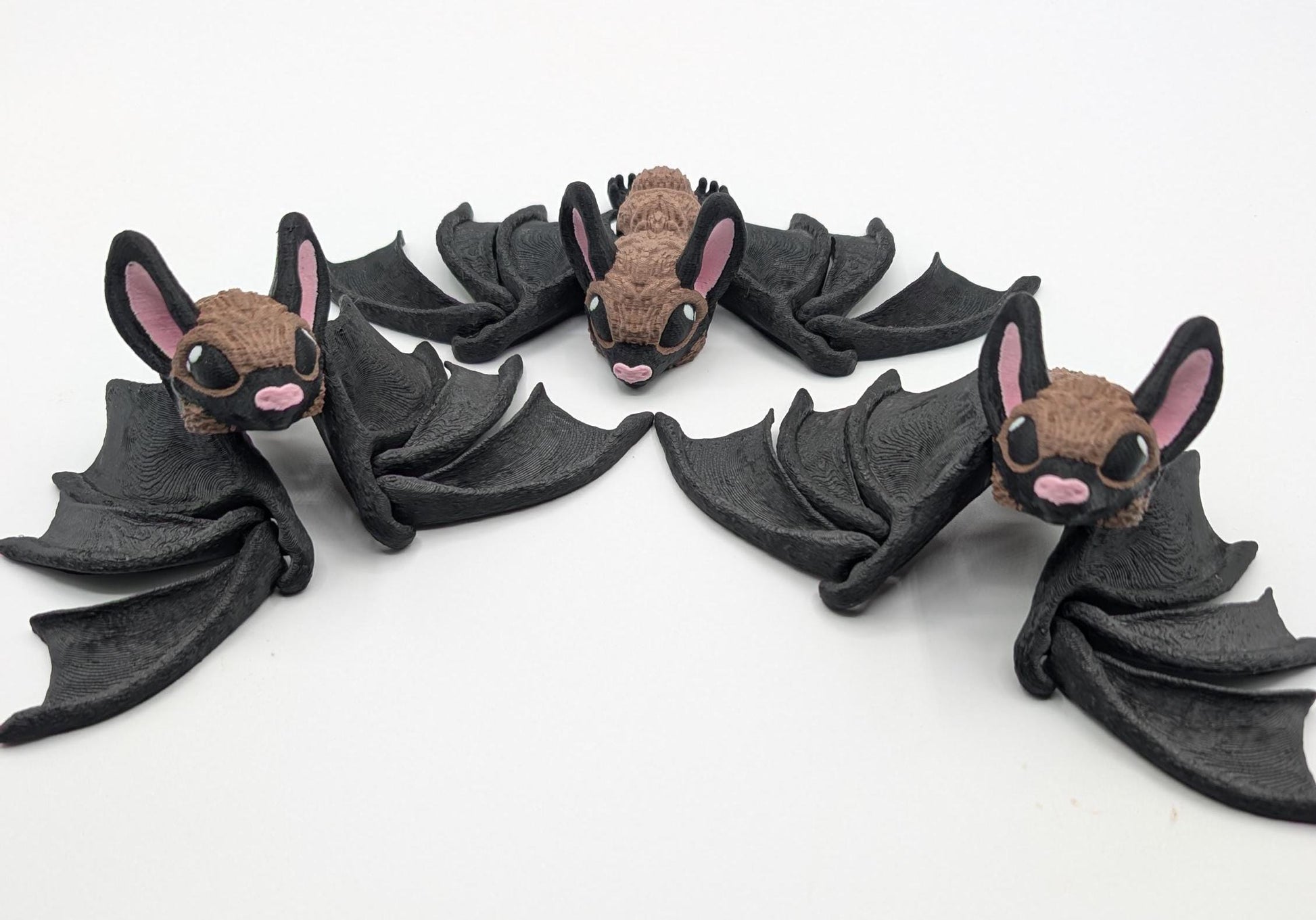 Our Adorable Articulating Bat features fully movable wings & joints, allowing for fun posing & display! Add playful yet spooky presence to any setting.