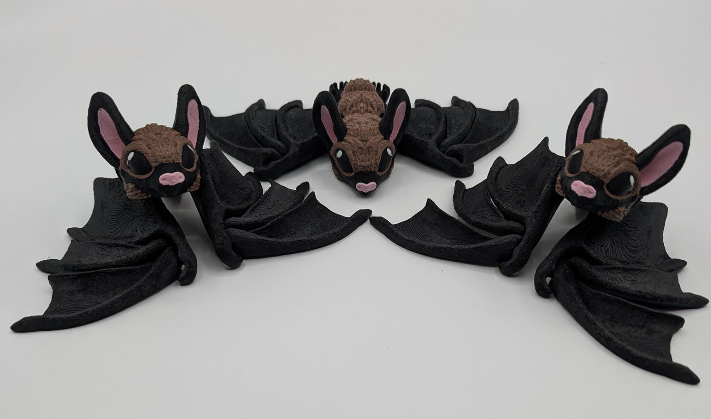 Our Adorable Articulating Bat features fully movable wings & joints, allowing for fun posing & display! Add playful yet spooky presence to any setting.