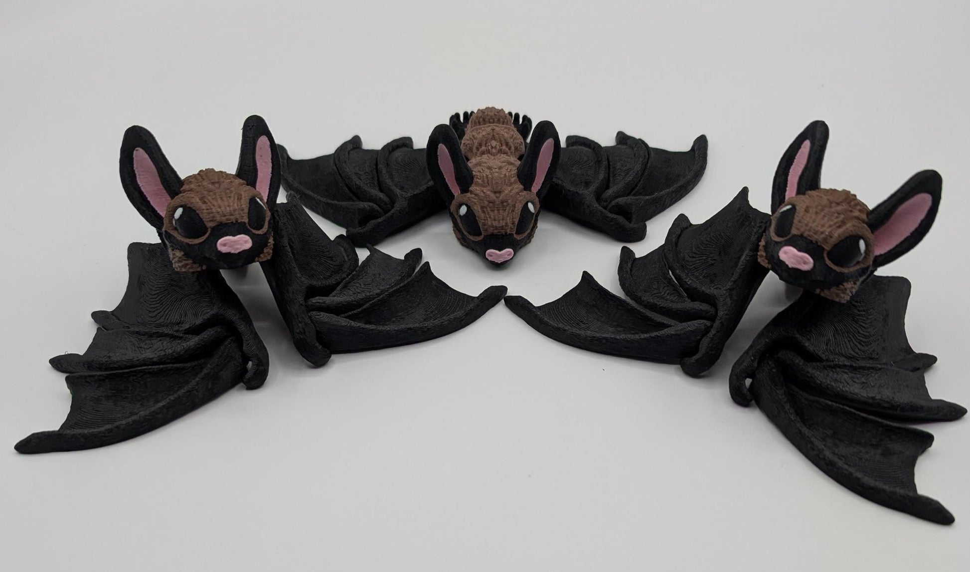 Our Adorable Articulating Bat features fully movable wings & joints, allowing for fun posing & display! Add playful yet spooky presence to any setting.