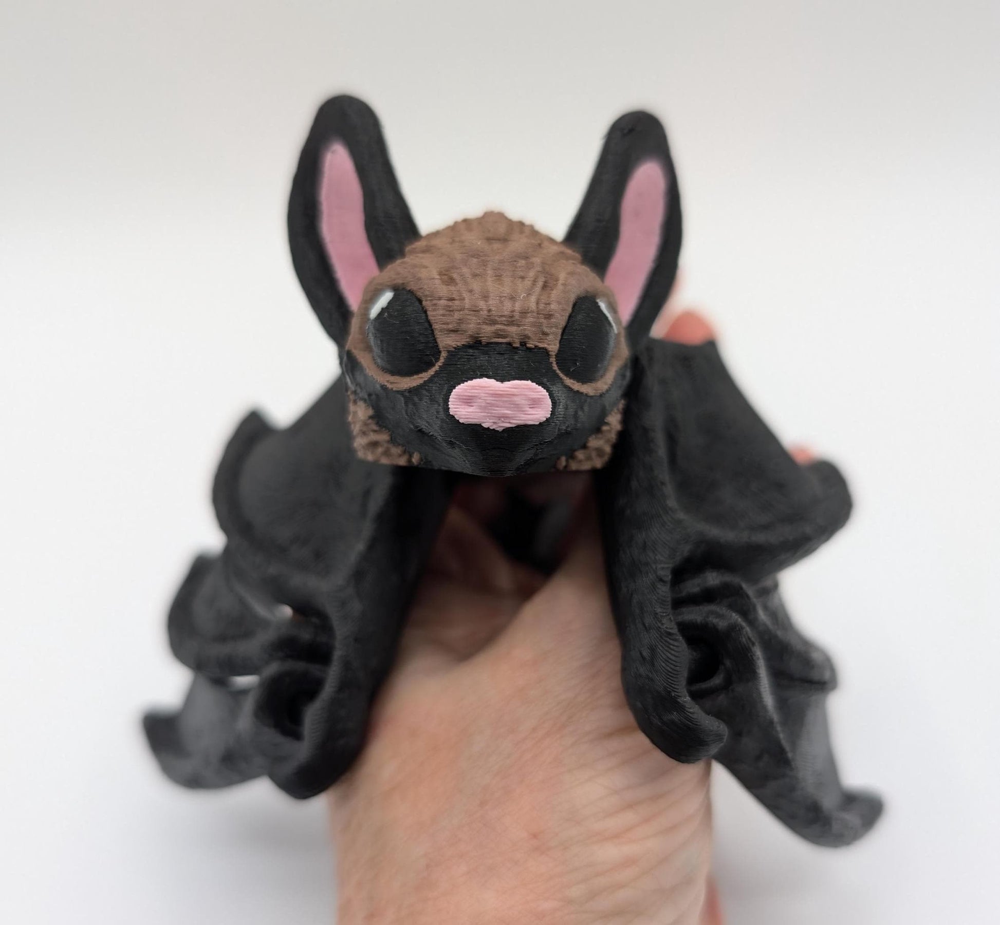 Our Adorable Articulating Bat features fully movable wings & joints, allowing for fun posing & display! Add playful yet spooky presence to any setting.