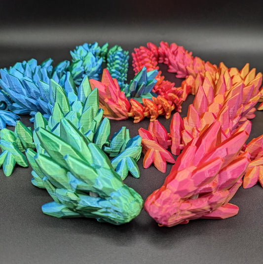 Our Beautiful Large Articulating Gemstone Dragon, combines the mystique of dragons with the elegance of gemstones is perfect for collectors, fantasy enthusiasts, and anyone looking to add a touch of magic to their home or office.