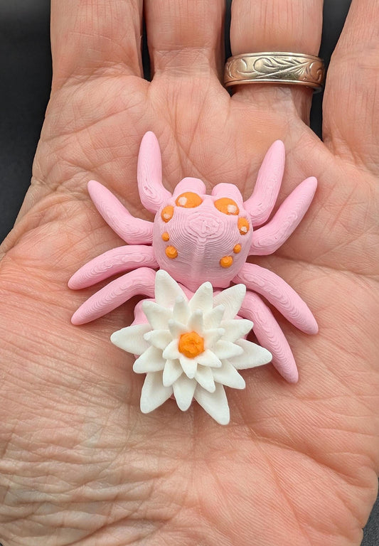 Introducing our Beautiful Articulating Water Lily Spider, a stunning blend of nature and art. Perfect for collectors and decor enthusiasts, this unique spider adds a touch of grace and whimsy to any space.