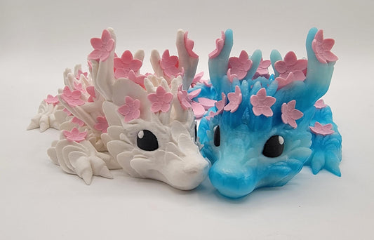 Introducing our Beautiful Articulated Baby Blossom Dragon Fidget Toy, a charming and playful addition to your collection.