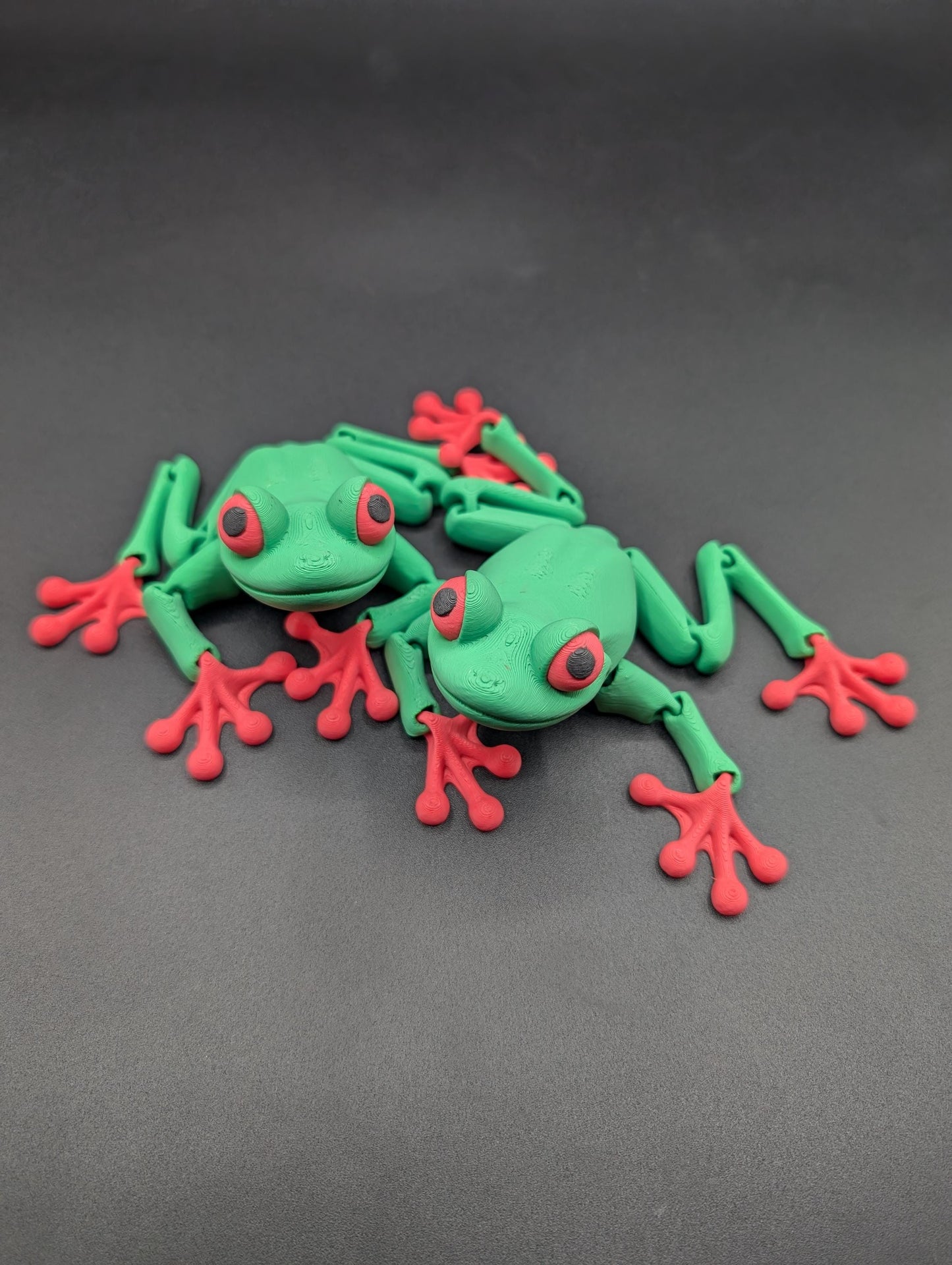 Frog 3D Printed Tree Frog Articulated Toy by Flexi Factory that will leap into your heart and spark your imagination.