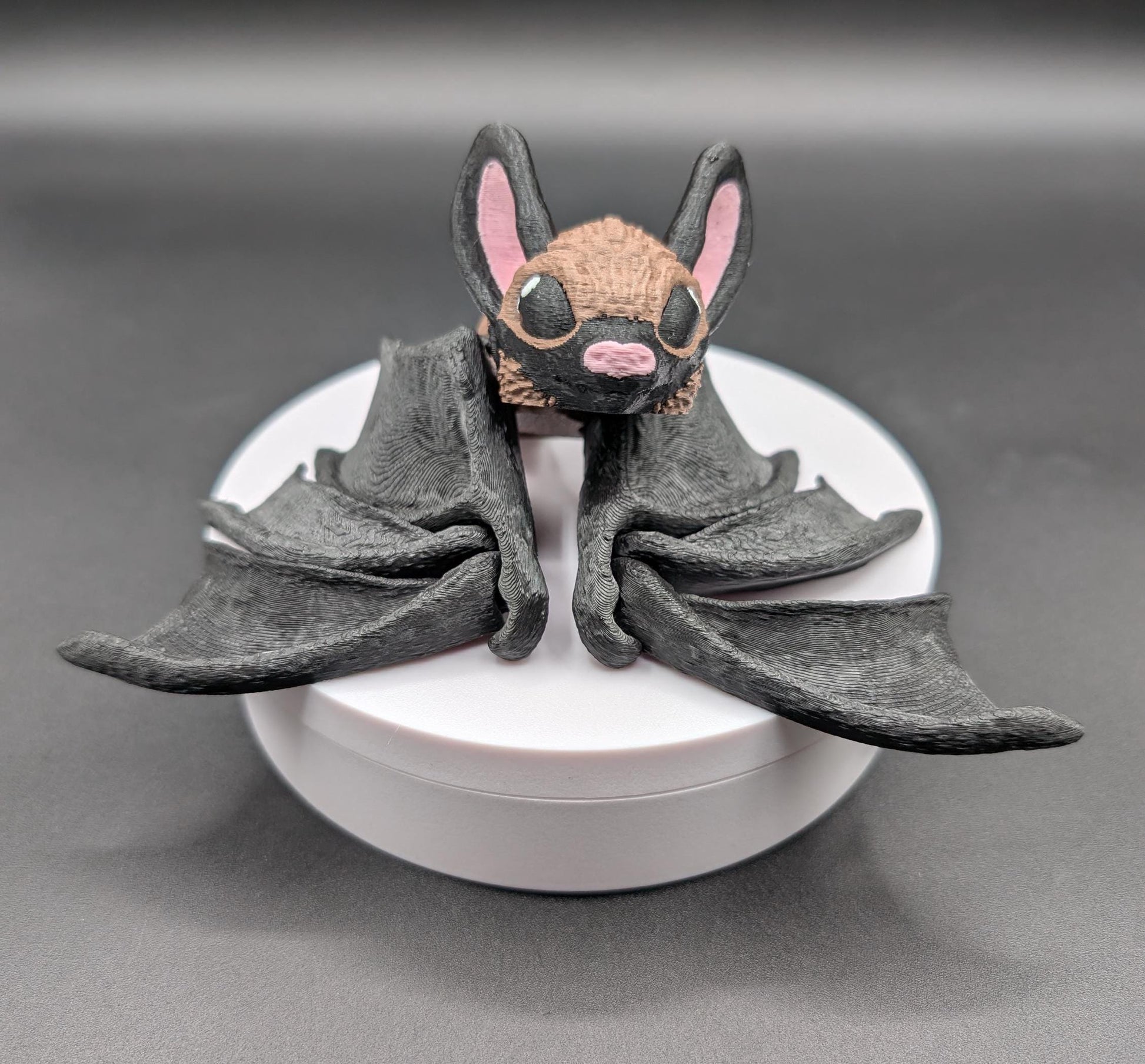 Our Adorable Articulating Bat features fully movable wings & joints, allowing for fun posing & display! Add playful yet spooky presence to any setting.