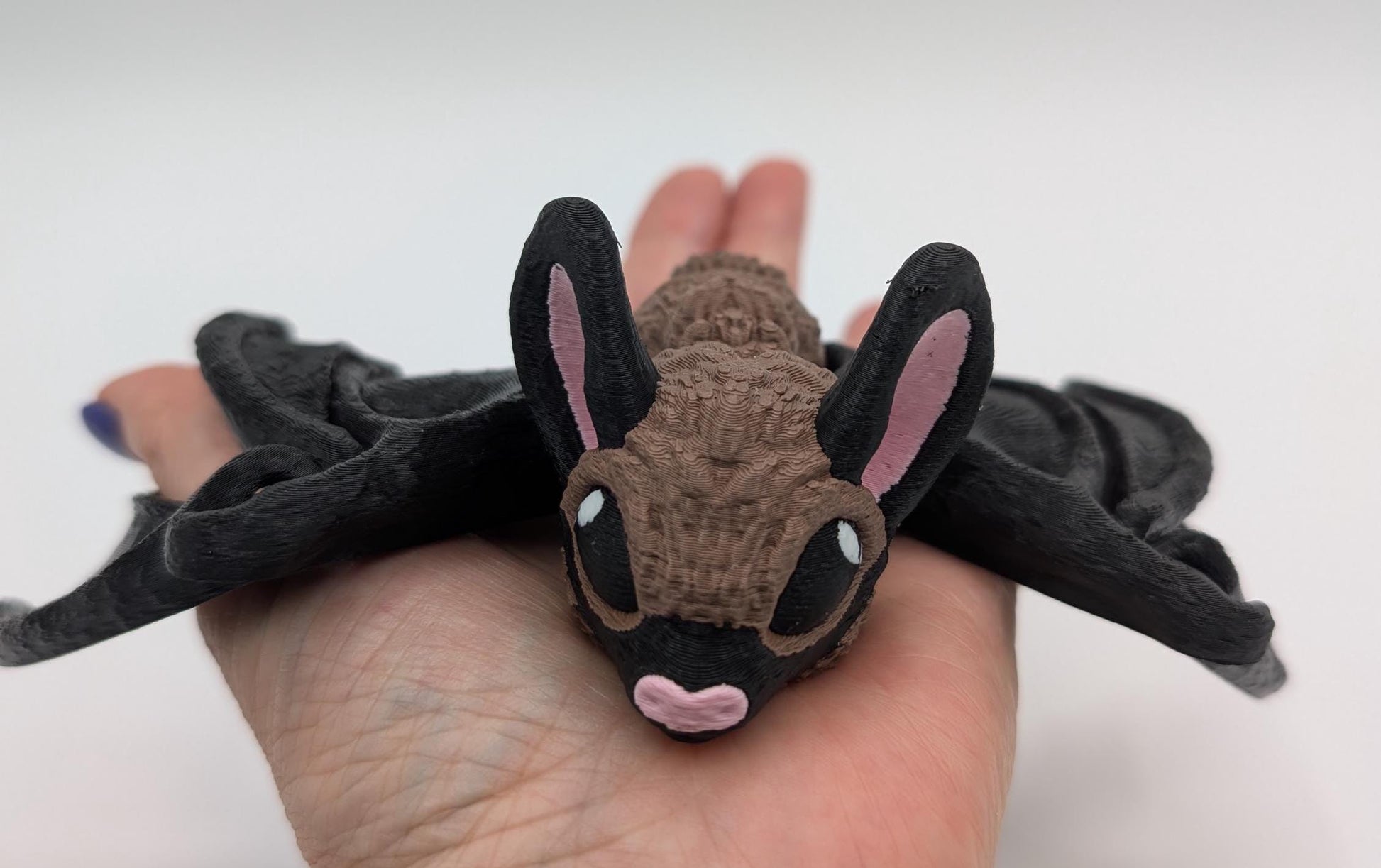 Our Adorable Articulating Bat features fully movable wings & joints, allowing for fun posing & display! Add playful yet spooky presence to any setting.