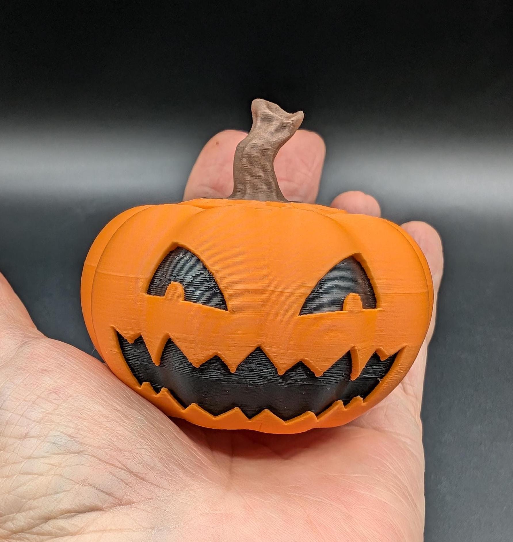 Introducing our Spooky Halloween Pumpkin Toy, a delightful blend of mischief & spooky fun. Perfect for Halloween enthusiasts & collectors, this pumpkin toy adds a playful touch to your seasonal decor. Top comes off to hide small items, even a spider!