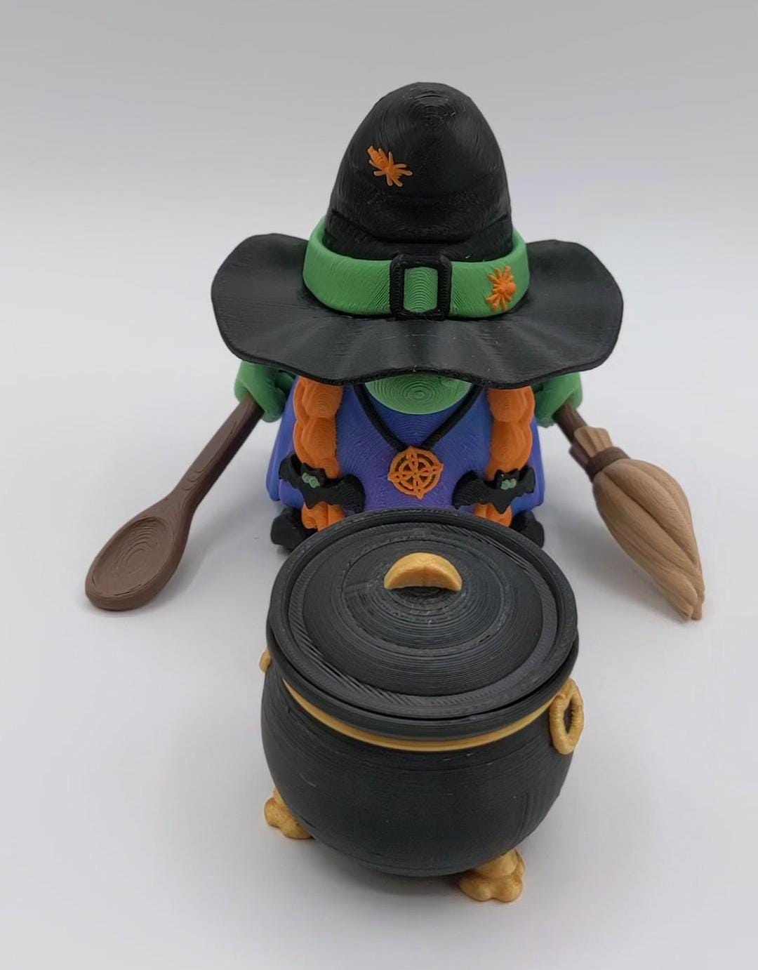 Meet our Articulated Halloween Witch Gnome with Cauldron, Broom, & Spoon! This delightful gnome brings whimsical magic to your seasonal decor. Perfect for Halloween enthusiasts and collectors, this piece is sure to add a playful charm to any setting.