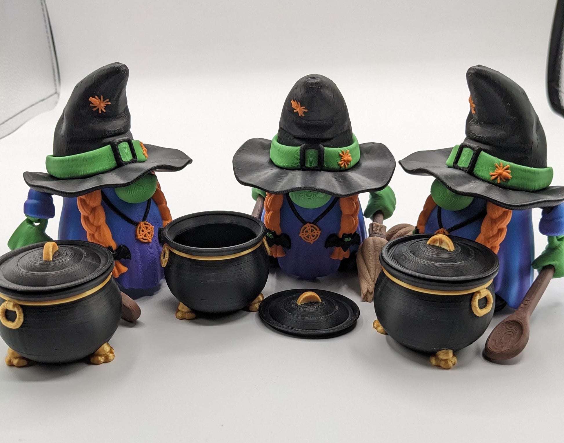 Meet our Articulated Halloween Witch Gnome with Cauldron, Broom, & Spoon! This delightful gnome brings whimsical magic to your seasonal decor. Perfect for Halloween enthusiasts and collectors, this piece is sure to add a playful charm to any setting.