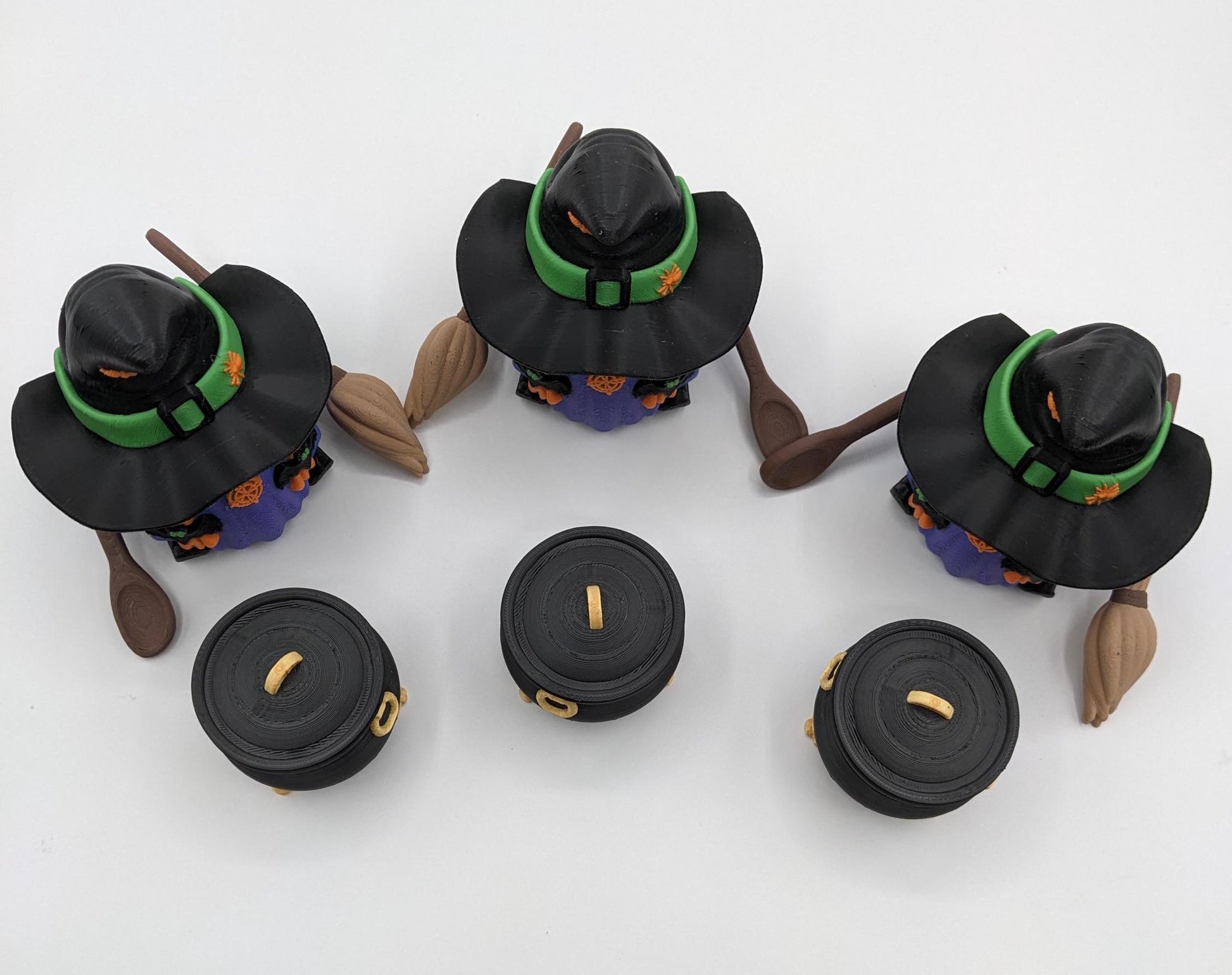 Meet our Articulated Halloween Witch Gnome with Cauldron, Broom, & Spoon! This delightful gnome brings whimsical magic to your seasonal decor. Perfect for Halloween enthusiasts and collectors, this piece is sure to add a playful charm to any setting.