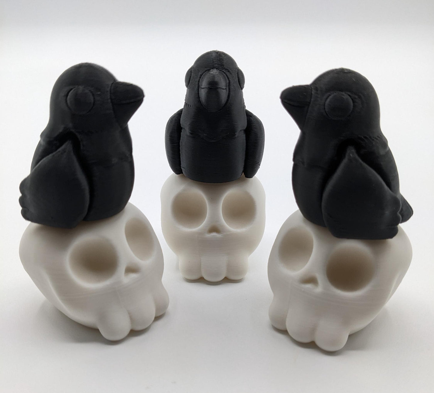 Our Poe Crow on a Skull features a meticulously crafted articulated crow perched on a skull, embodying the perfect blend of mystery and sophistication. Ideal for Halloween or year-round Gothic decor, it's sure to become a conversation starter.