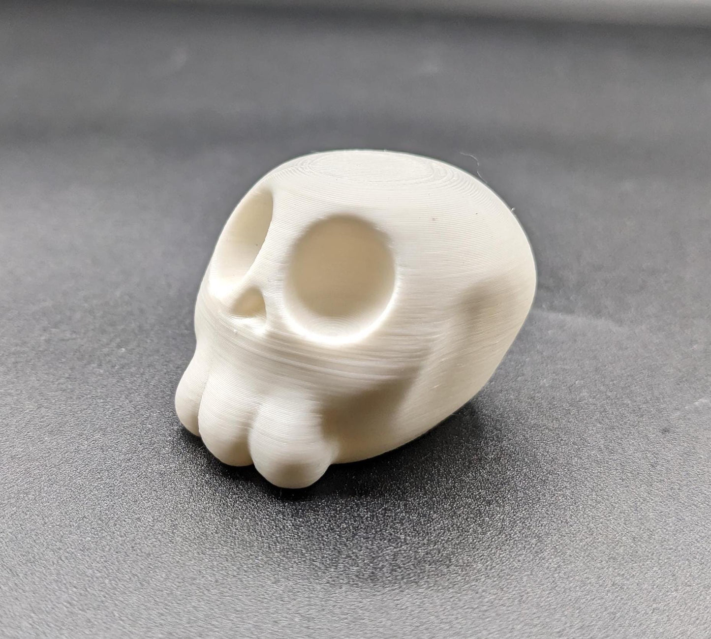 Our Poe Crow on a Skull features a meticulously crafted articulated crow perched on a skull, embodying the perfect blend of mystery and sophistication. Ideal for Halloween or year-round Gothic decor, it's sure to become a conversation starter.