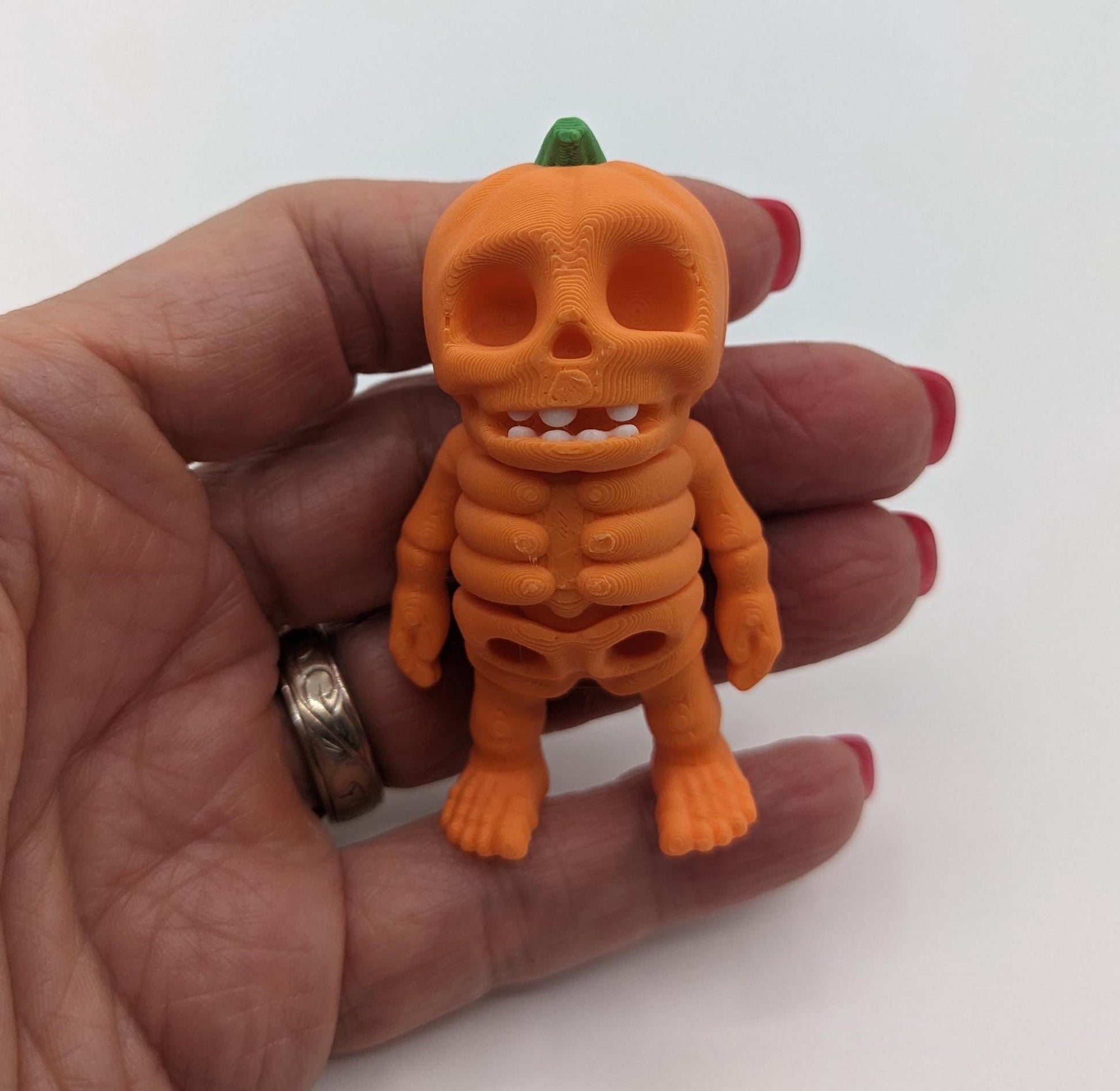 Our Halloween Pumpkin Skeleton Fidget Toy combines the festive charm of a pumpkin with the spooky allure of a skeleton, offering both fun and stress relief. Perfect for Halloween lovers and fidget enthusiasts!