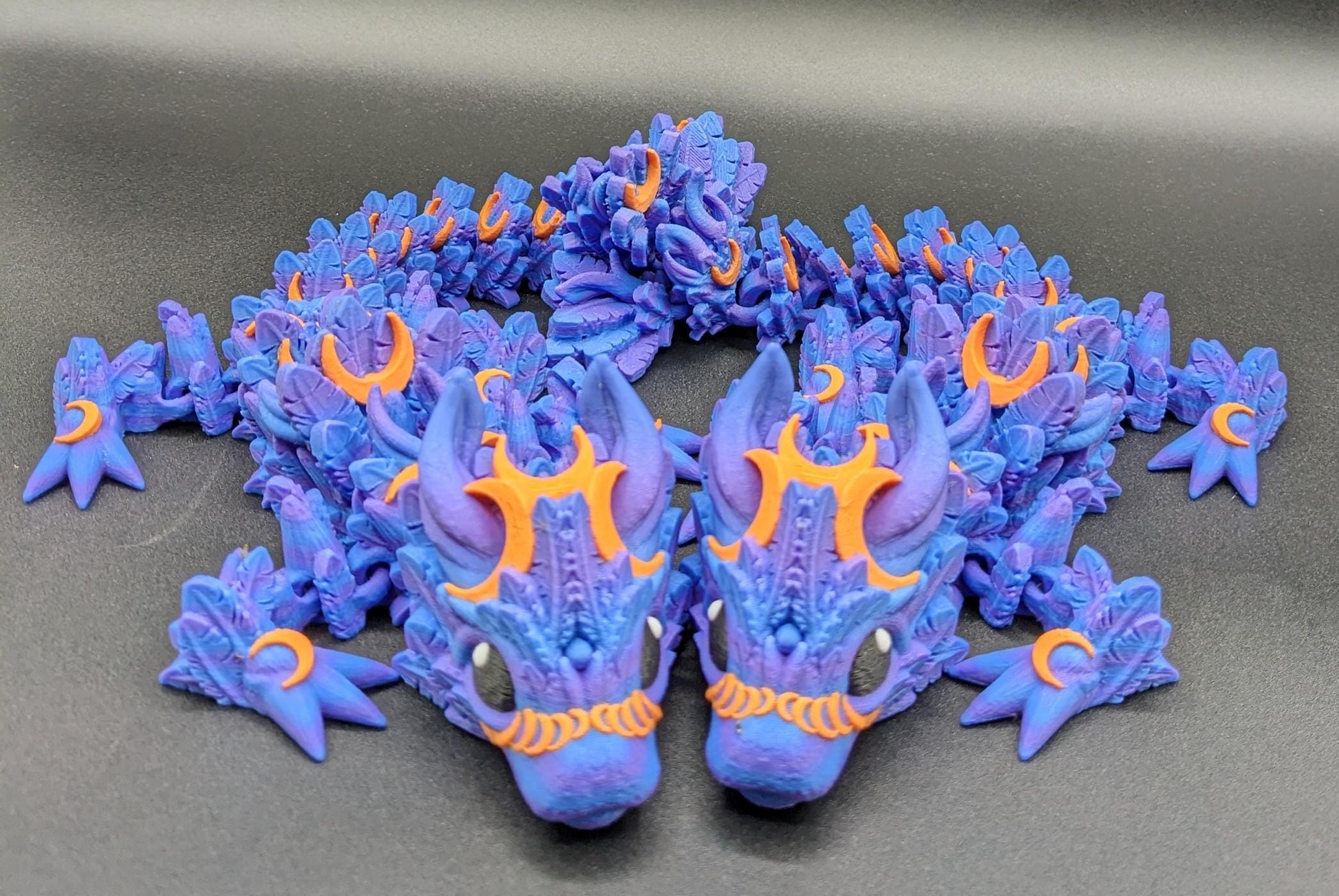 Our Halloween Lunar Dragon will add a touch of lunar magic to your Halloween decor enhancing a playful and mystical appeal. Perfect for adding a whimsical touch to any space, this dragon is sure to delight fans of all ages.