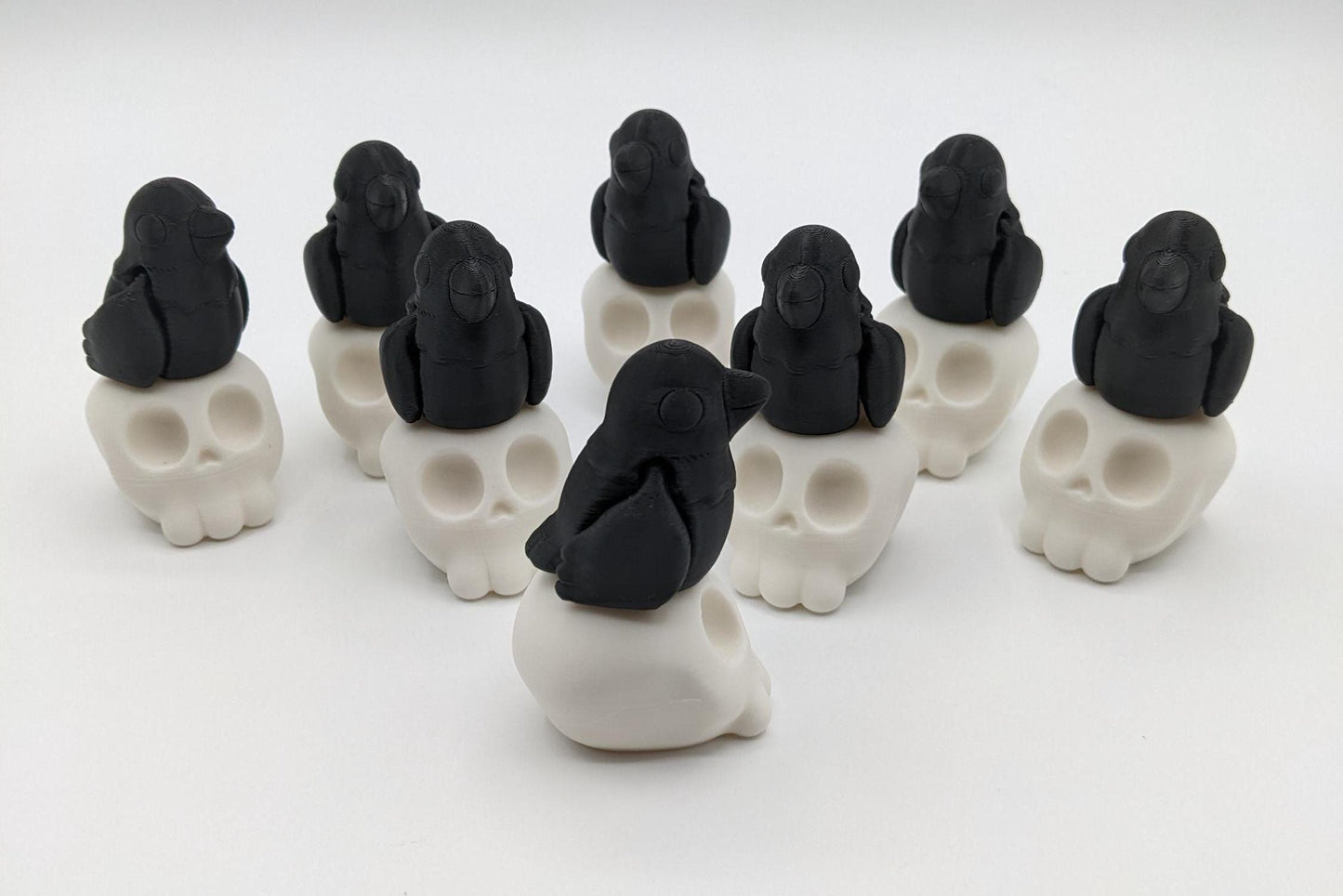 Our Poe Crow on a Skull features a meticulously crafted articulated crow perched on a skull, embodying the perfect blend of mystery and sophistication. Ideal for Halloween or year-round Gothic decor, it's sure to become a conversation starter.