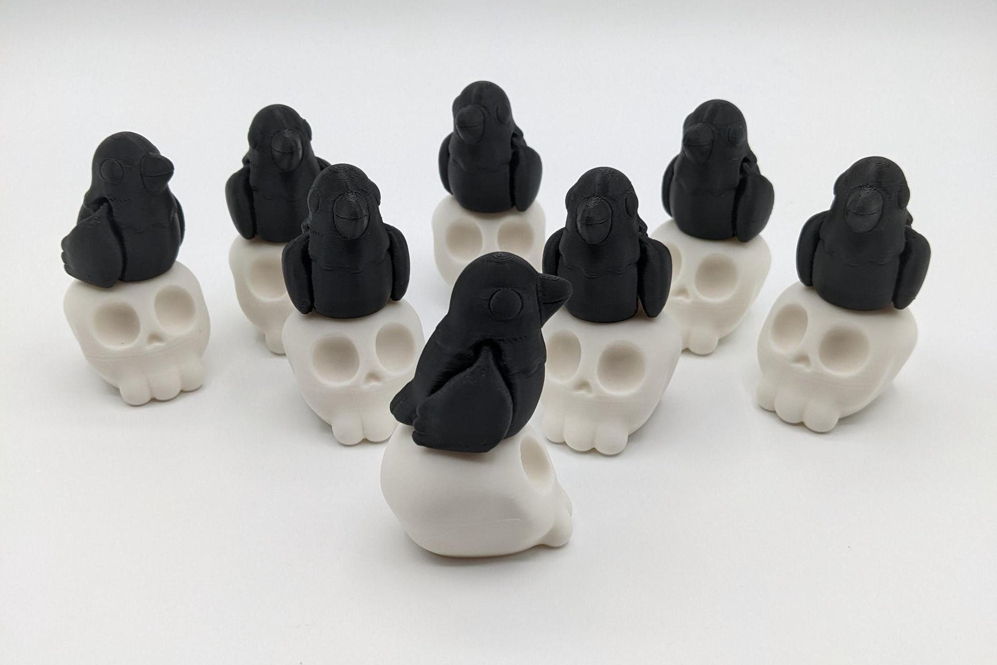 Our Poe Crow on a Skull features a meticulously crafted articulated crow perched on a skull, embodying the perfect blend of mystery and sophistication. Ideal for Halloween or year-round Gothic decor, it's sure to become a conversation starter.