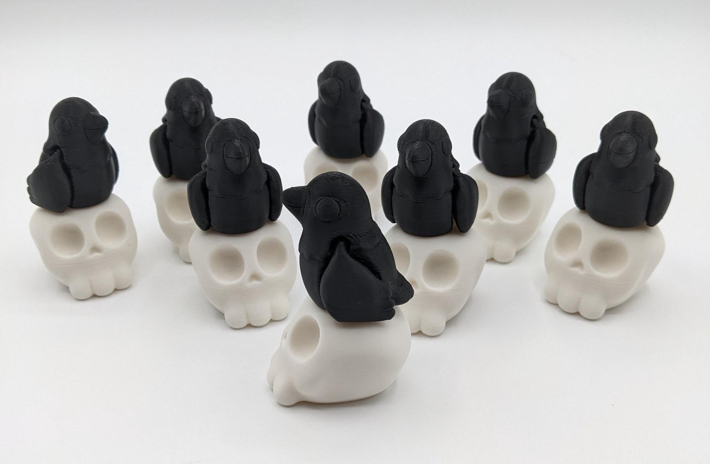 Our Poe Crow on a Skull features a meticulously crafted articulated crow perched on a skull, embodying the perfect blend of mystery and sophistication. Ideal for Halloween or year-round Gothic decor, it's sure to become a conversation starter.