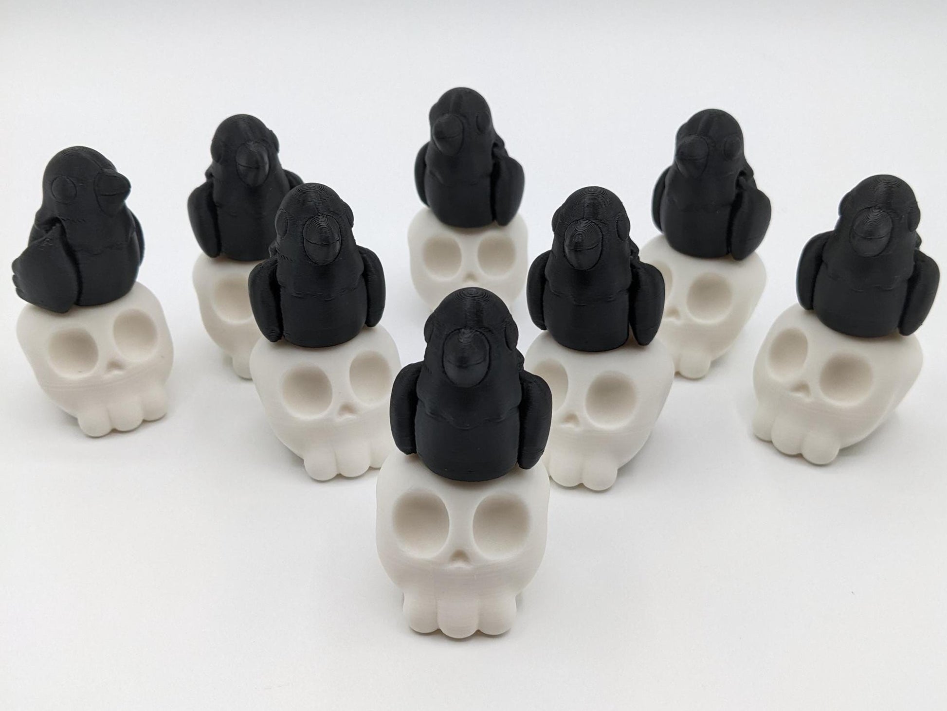 Our Poe Crow on a Skull features a meticulously crafted articulated crow perched on a skull, embodying the perfect blend of mystery and sophistication. Ideal for Halloween or year-round Gothic decor, it's sure to become a conversation starter.