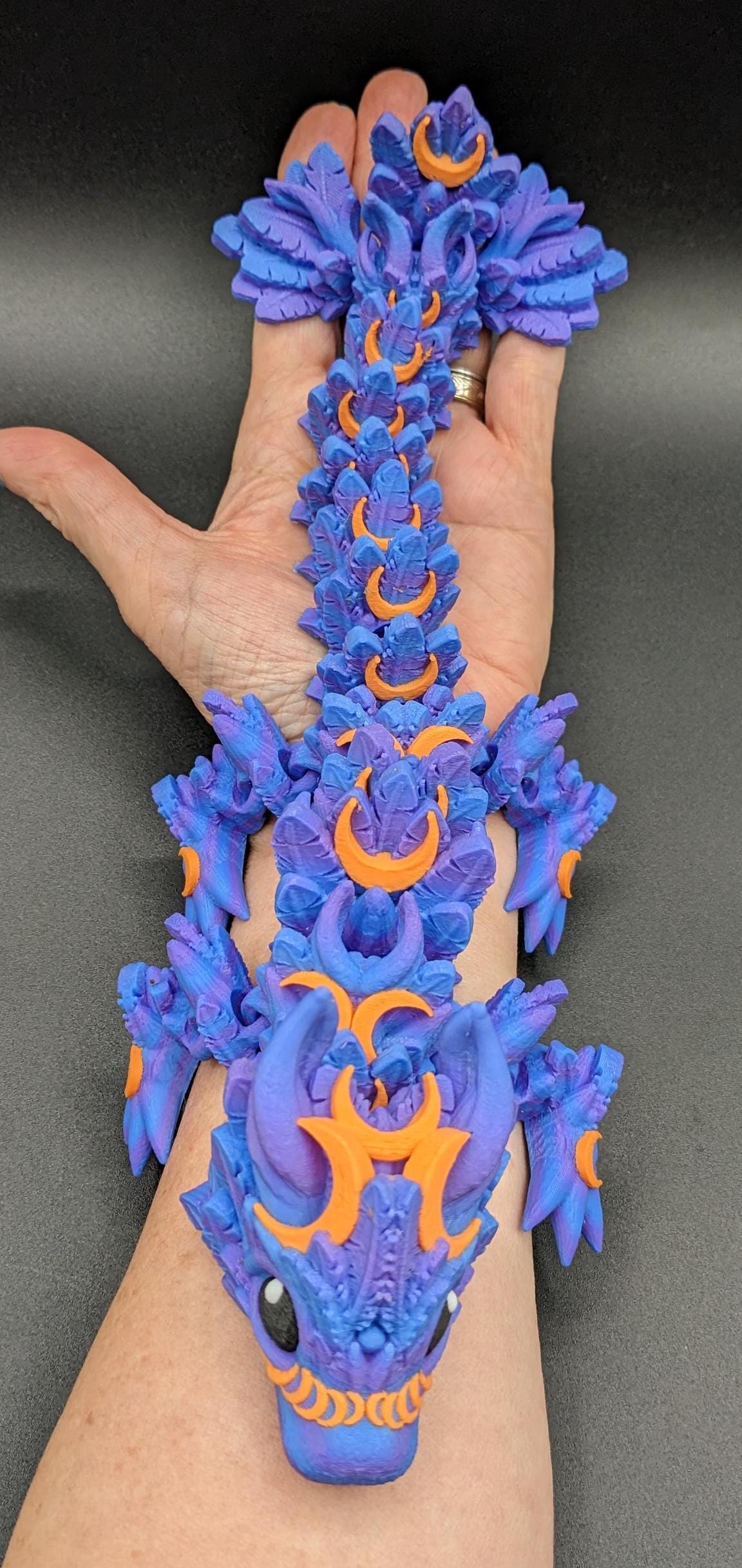 Our Halloween Lunar Dragon will add a touch of lunar magic to your Halloween decor enhancing a playful and mystical appeal. Perfect for adding a whimsical touch to any space, this dragon is sure to delight fans of all ages.