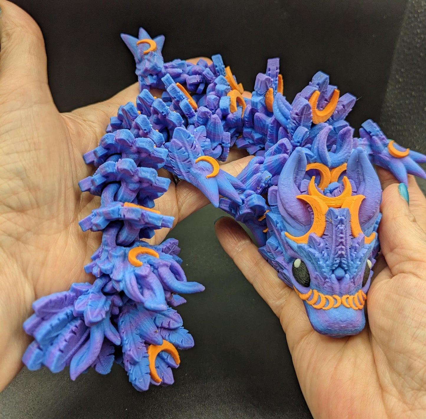 Our Halloween Lunar Dragon will add a touch of lunar magic to your Halloween decor enhancing a playful and mystical appeal. Perfect for adding a whimsical touch to any space, this dragon is sure to delight fans of all ages.