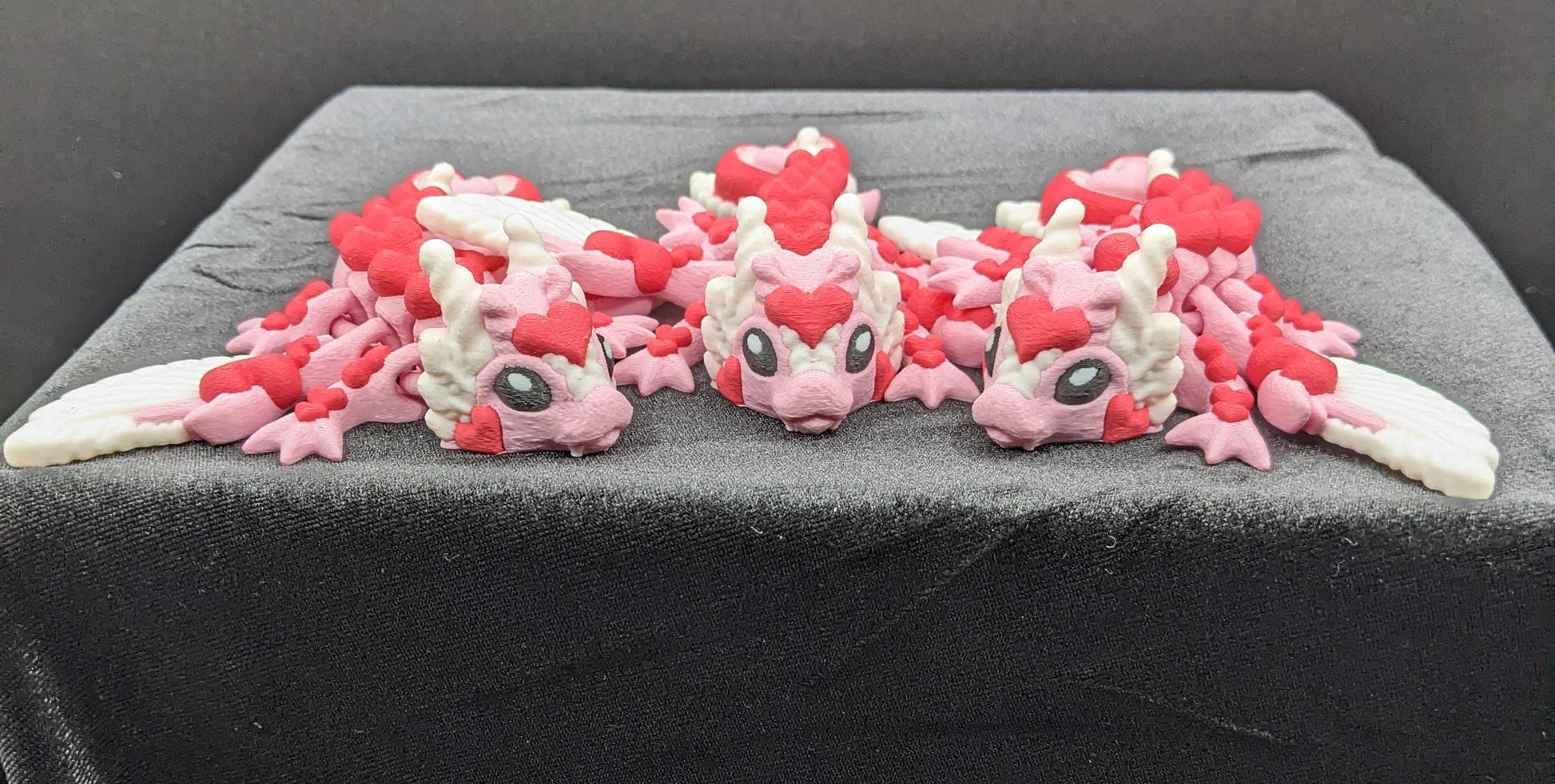 Discover the magic of our Valentine Heart Dragon! This enchanting articulating dragon not only graces your bookshelf with whimsy but also makes for a heartfelt and unforgettable Valentine's Day gift.