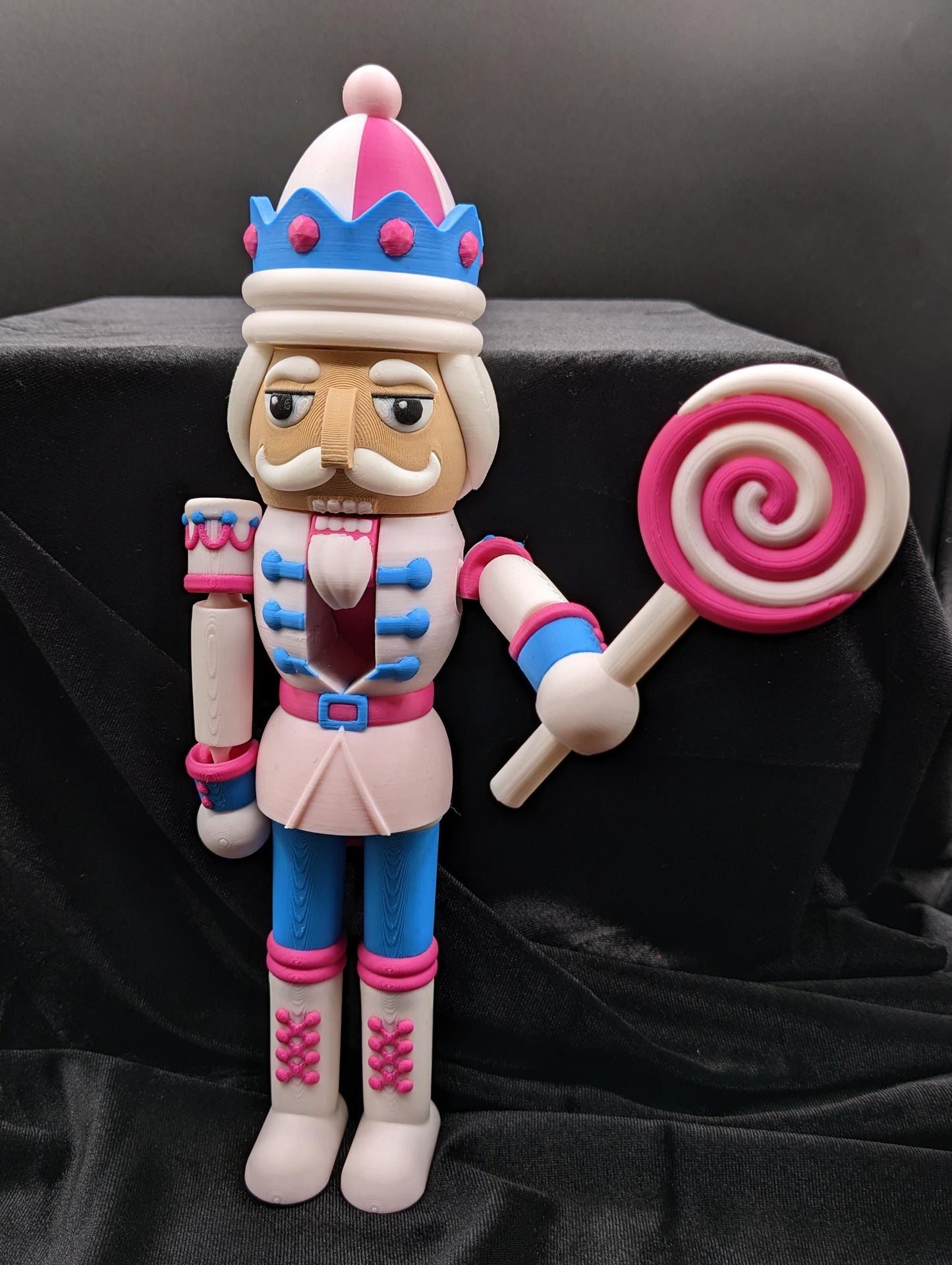 Celebrate the season with our Distinguished Articulated Christmas Nutcracker. Our handsome nutcrackers  can be posed to enhance its regal presence. Perfect for mantels, shelves, or as a centerpiece, a timeless addition to your holiday collection.