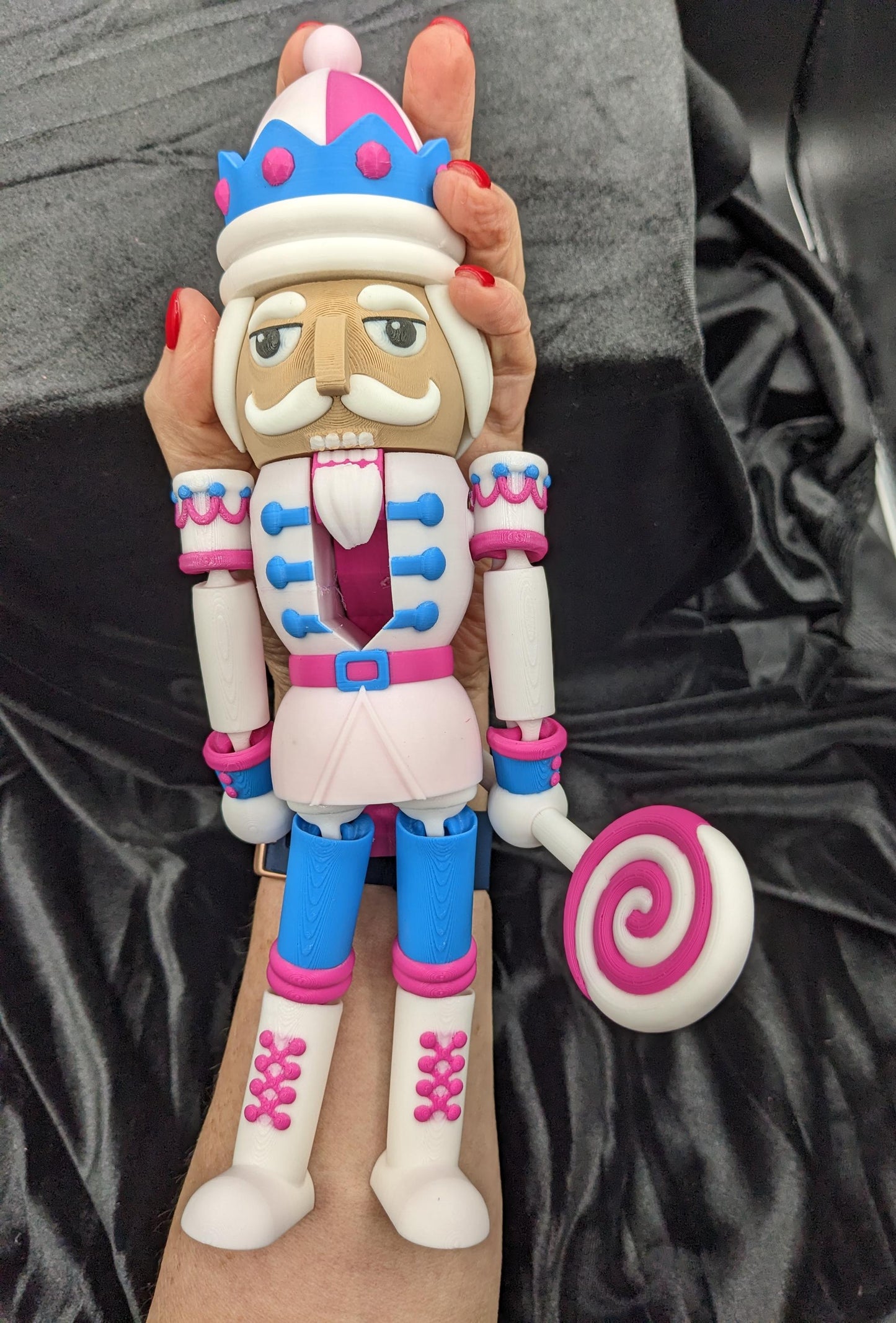 Celebrate the season with our Distinguished Articulated Christmas Nutcracker. Our handsome nutcrackers  can be posed to enhance its regal presence. Perfect for mantels, shelves, or as a centerpiece, a timeless addition to your holiday collection.