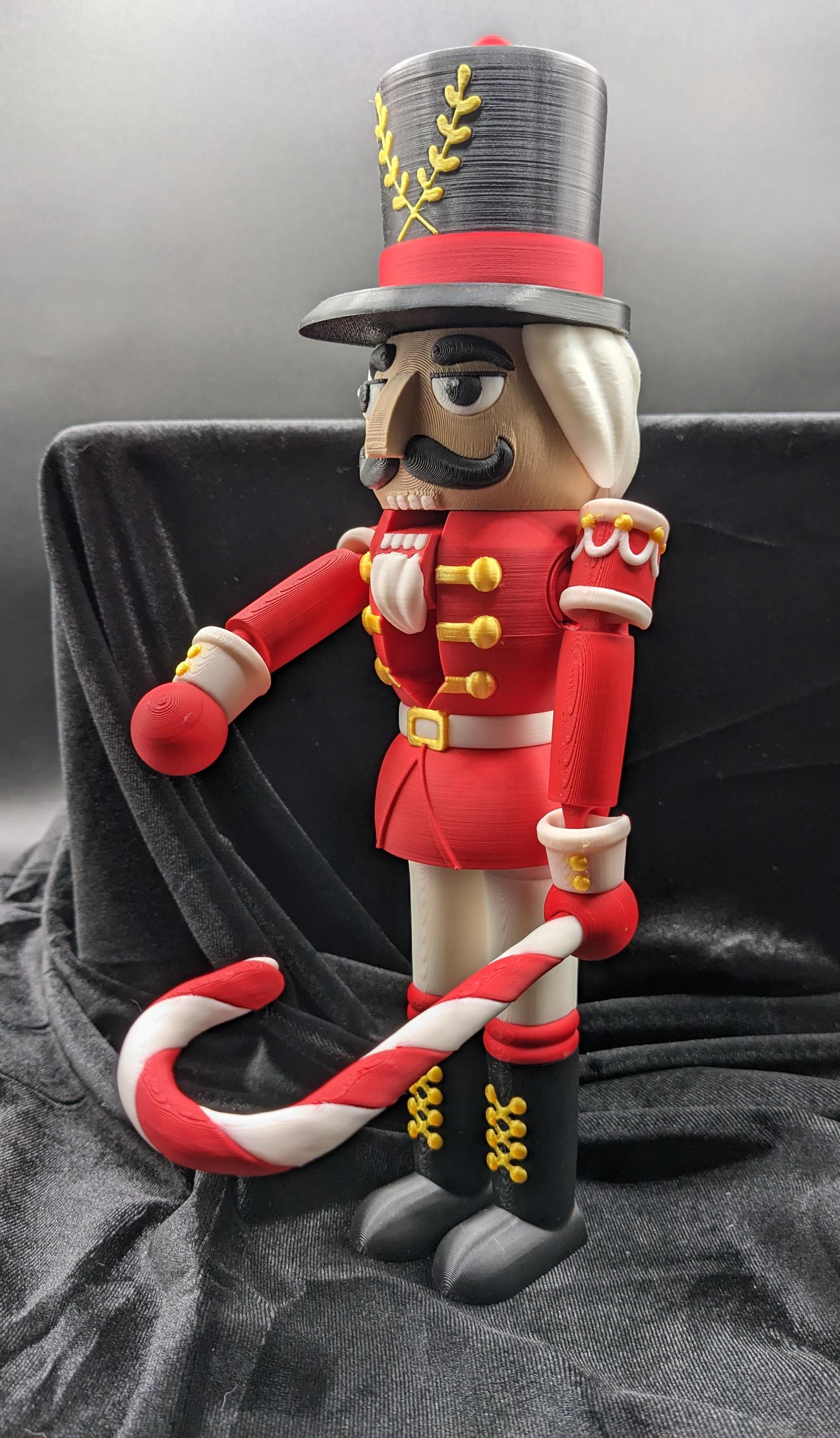 Celebrate the season with our Distinguished Articulated Christmas Nutcracker. Our handsome nutcrackers  can be posed to enhance its regal presence. Perfect for mantels, shelves, or as a centerpiece, a timeless addition to your holiday collection.