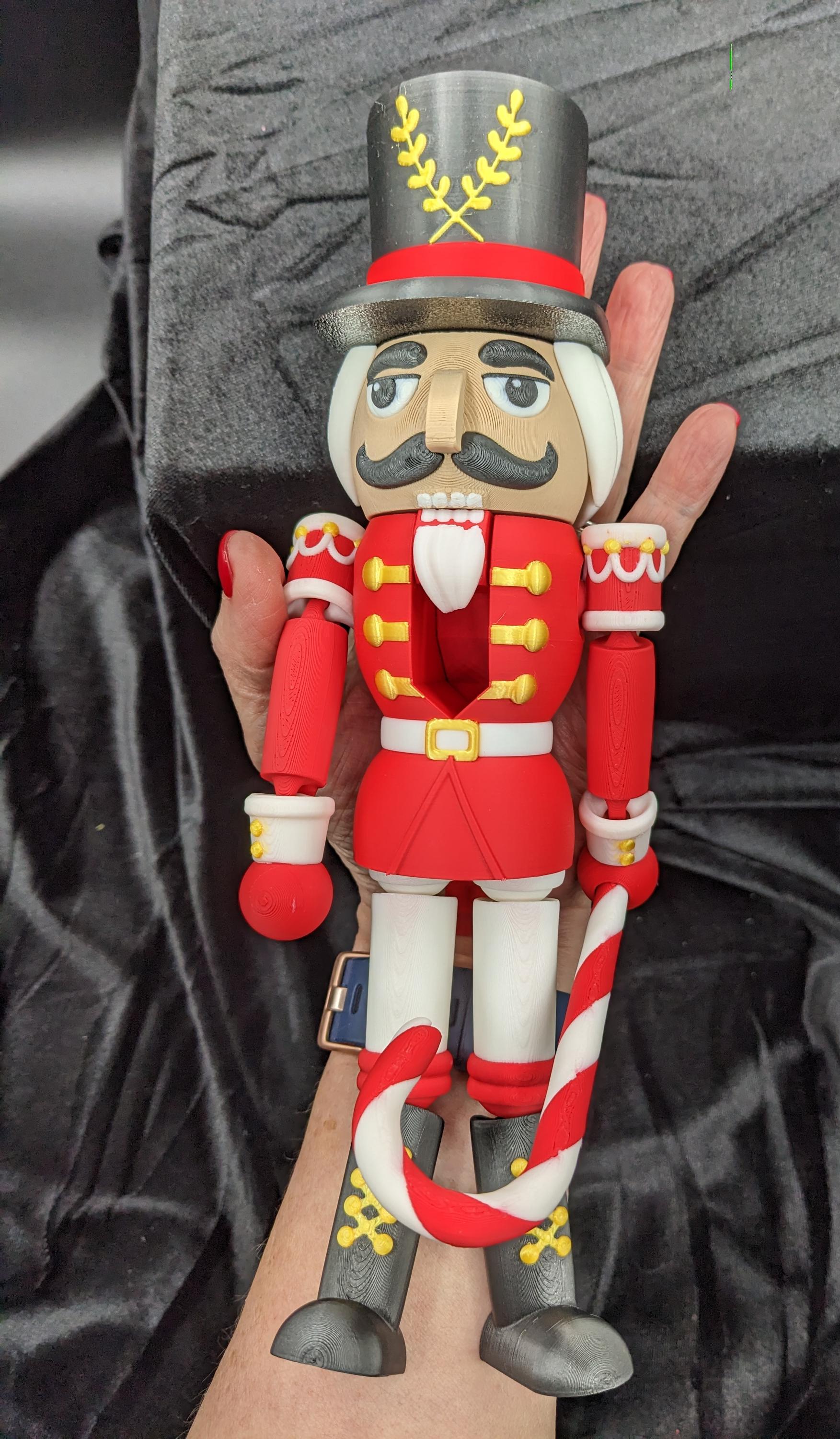 Celebrate the season with our Distinguished Articulated Christmas Nutcracker. Our handsome nutcrackers  can be posed to enhance its regal presence. Perfect for mantels, shelves, or as a centerpiece, a timeless addition to your holiday collection.
