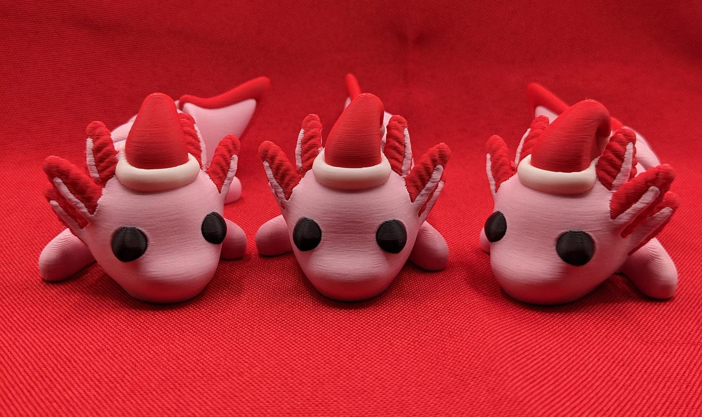 Celebrate the joy of the season with our Articulated Winter Christmas Axolotl Fidget Toy with a cute little Santa hat. This adorable and festive axolotl is perfect for spreading holiday cheer and providing endless fun.