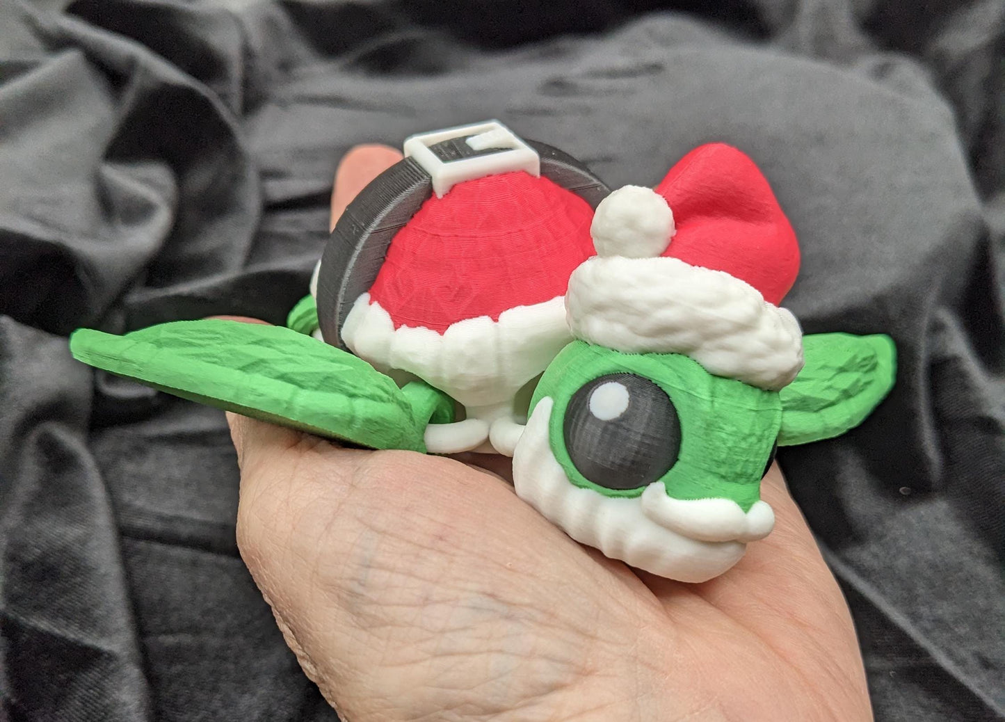 Bring holiday cheer with our Jolly Articulated Santa Sea Turtle! Our festive turtle is dressed for the season in a Santa-inspired suit ensured to bring joy and smiles for the holiday season!