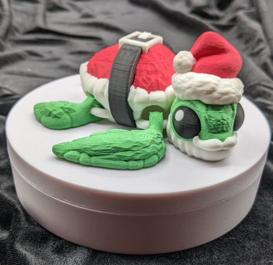 Bring holiday cheer with our Jolly Articulated Santa Sea Turtle! Our festive turtle is dressed for the season in a Santa-inspired suit ensured to bring joy and smiles for the holiday season!