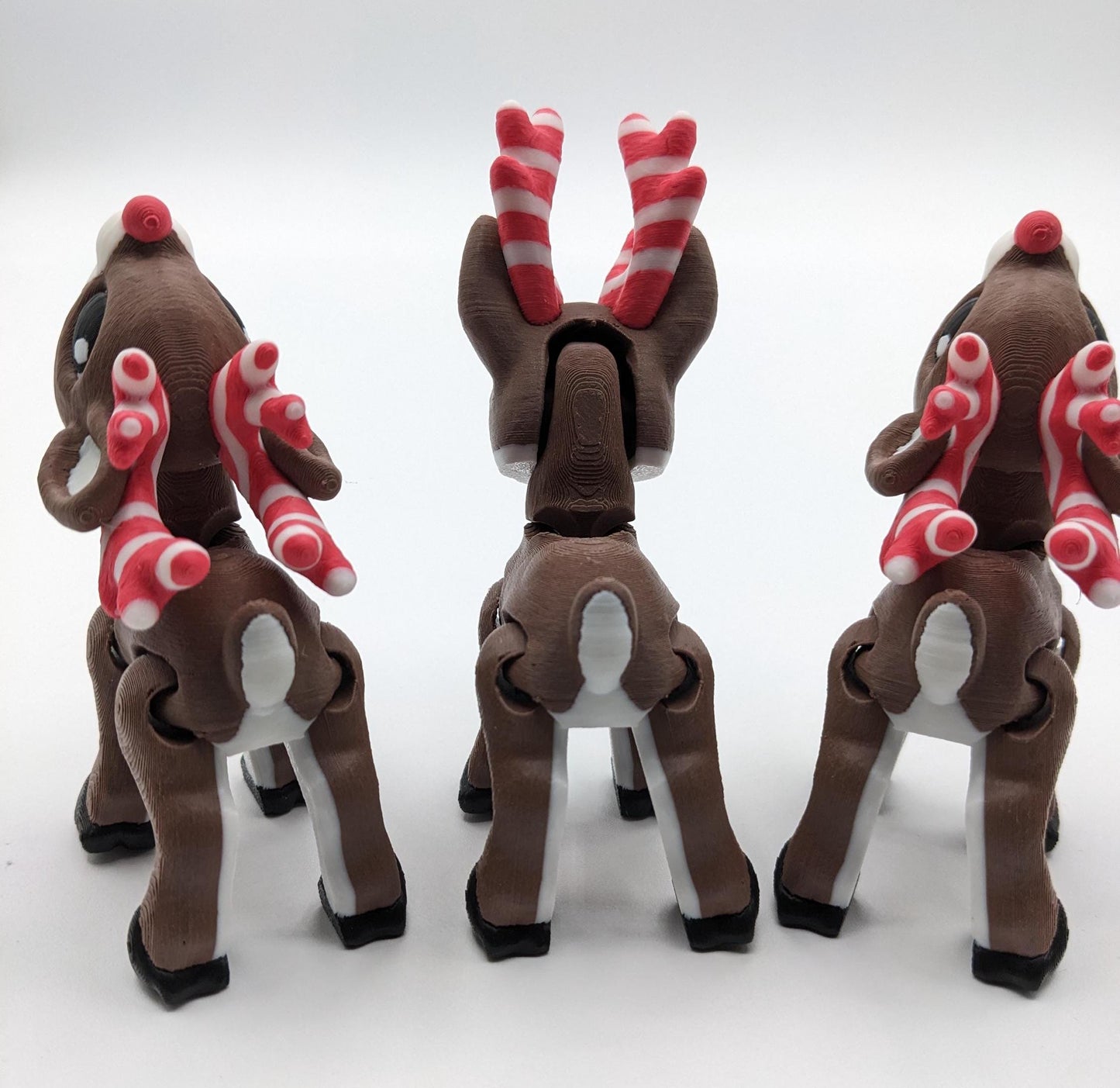 Our baby reindeer, inspired by holiday candy canes, is the perfect blend of fun & festive  creativity. Fully articulated & poseable body, this fidget toy is ideal for stress relief, creative play, or adding a whimsical touch to your Christmas decor.