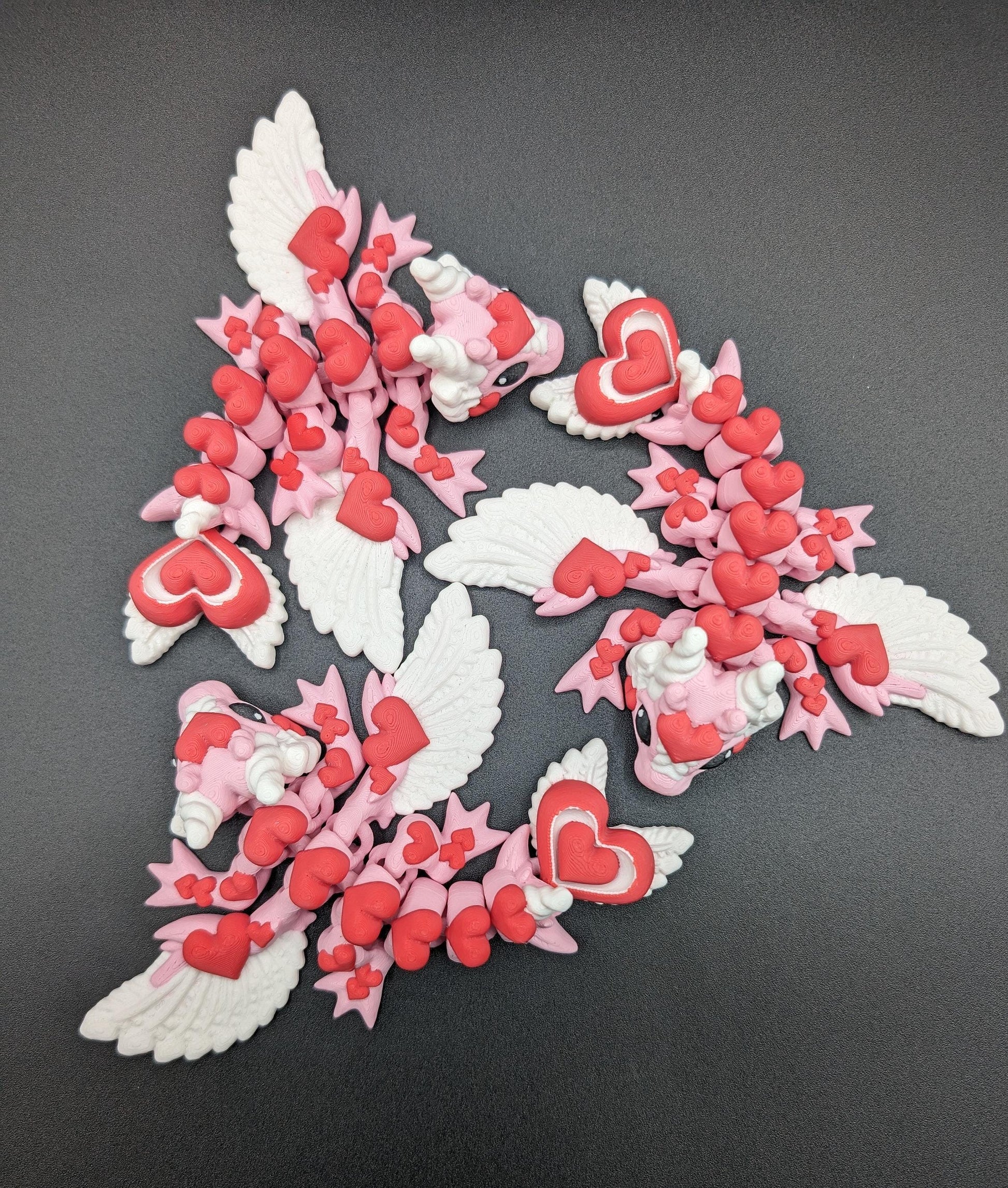 Discover the magic of our Valentine Heart Dragon! This enchanting articulating dragon not only graces your bookshelf with whimsy but also makes for a heartfelt and unforgettable Valentine's Day gift.