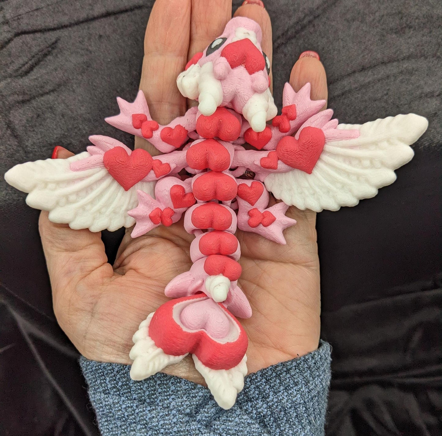 Discover the magic of our Valentine Heart Dragon! This enchanting articulating dragon not only graces your bookshelf with whimsy but also makes for a heartfelt and unforgettable Valentine's Day gift.