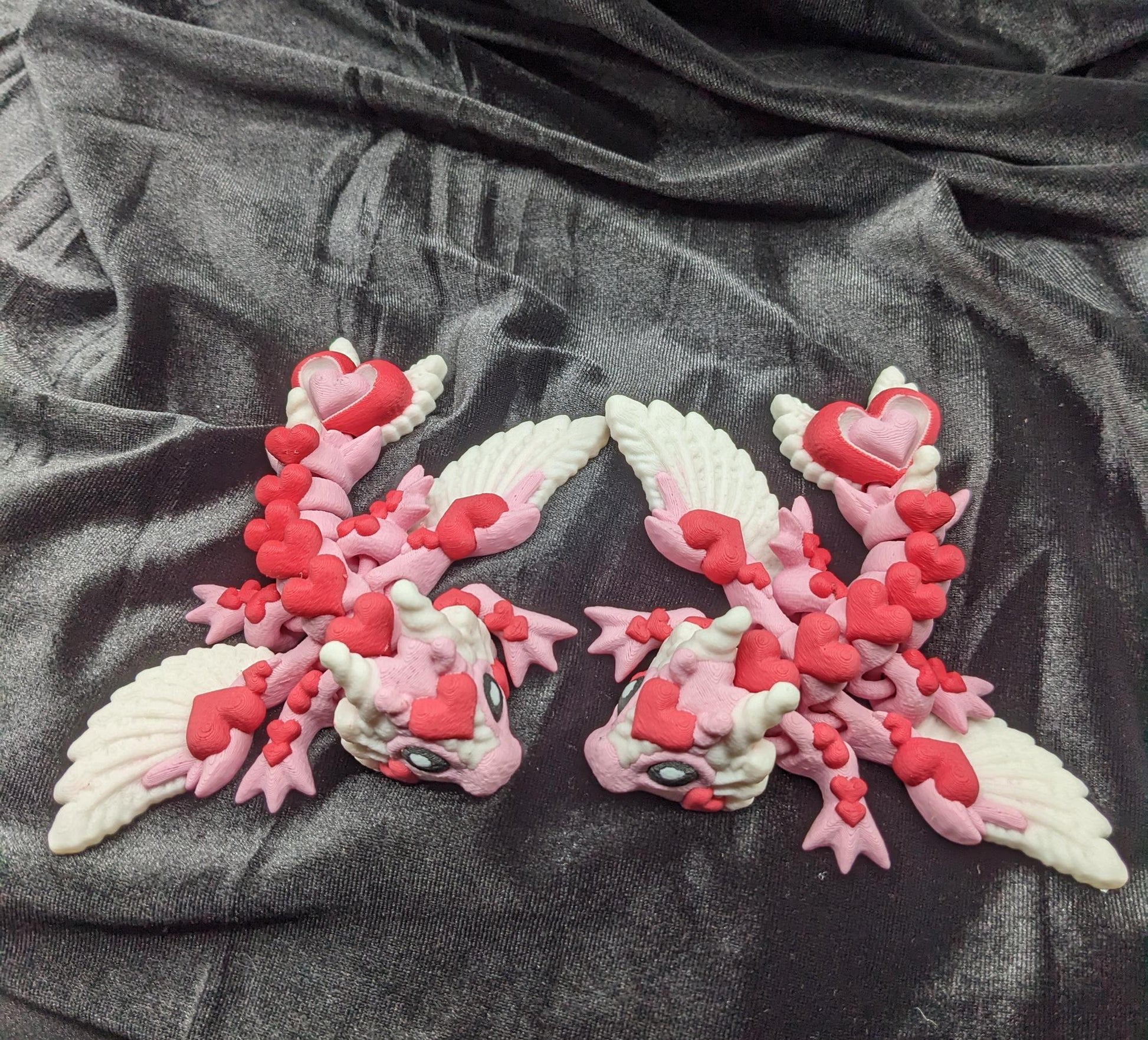 Discover the magic of our Valentine Heart Dragon! This enchanting articulating dragon not only graces your bookshelf with whimsy but also makes for a heartfelt and unforgettable Valentine's Day gift.