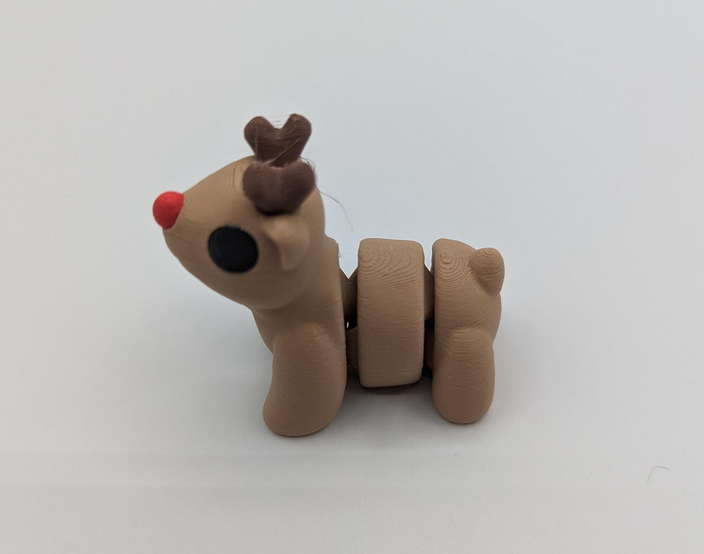 Bring holiday cheer with our Adorable Baby Reindeer Fidget Toy. This cute and festive reindeer is perfect for adding a playful touch to your holiday celebrations.