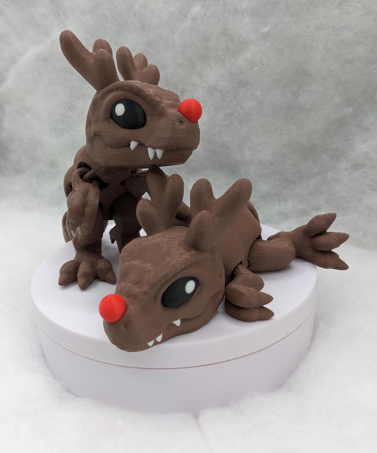 Our Christmas T-Rex combines the charm of Christmas with the fun of dinosaurs. An interactive toy for kids & adults alike,  articulated joints for posing & fidgeting, T-Rex is perfect as a stocking stuffer, desk toy, or playful holiday decoration.