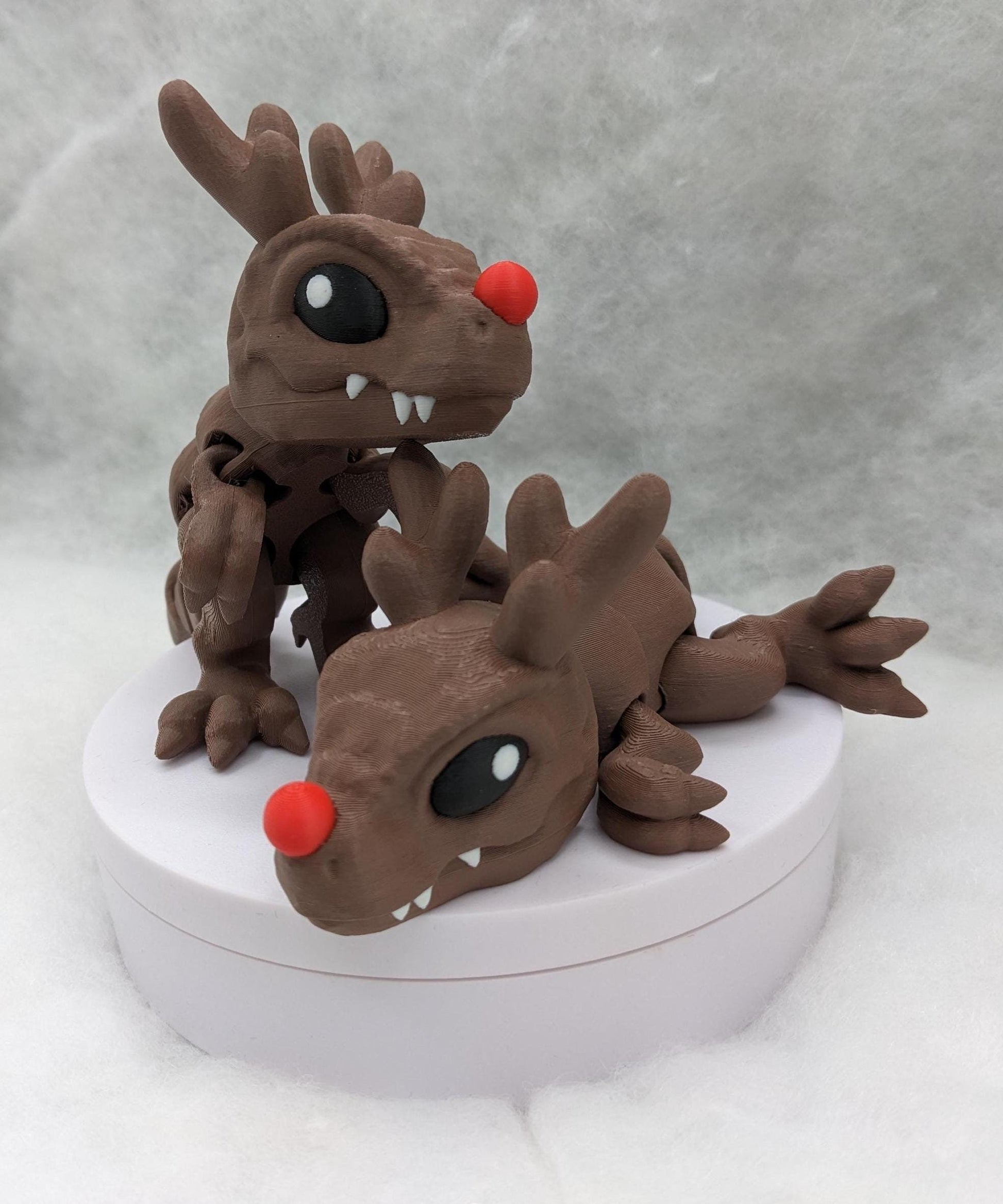 Our Christmas T-Rex combines the charm of Christmas with the fun of dinosaurs. An interactive toy for kids & adults alike,  articulated joints for posing & fidgeting, T-Rex is perfect as a stocking stuffer, desk toy, or playful holiday decoration.