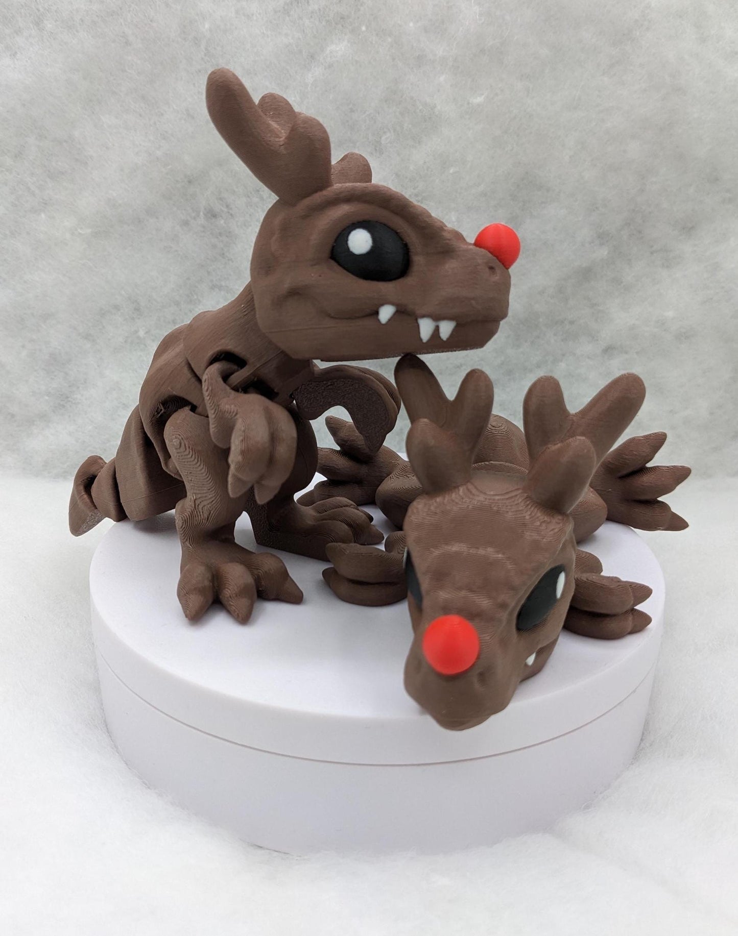 Our Christmas T-Rex combines the charm of Christmas with the fun of dinosaurs. An interactive toy for kids & adults alike,  articulated joints for posing & fidgeting, T-Rex is perfect as a stocking stuffer, desk toy, or playful holiday decoration.