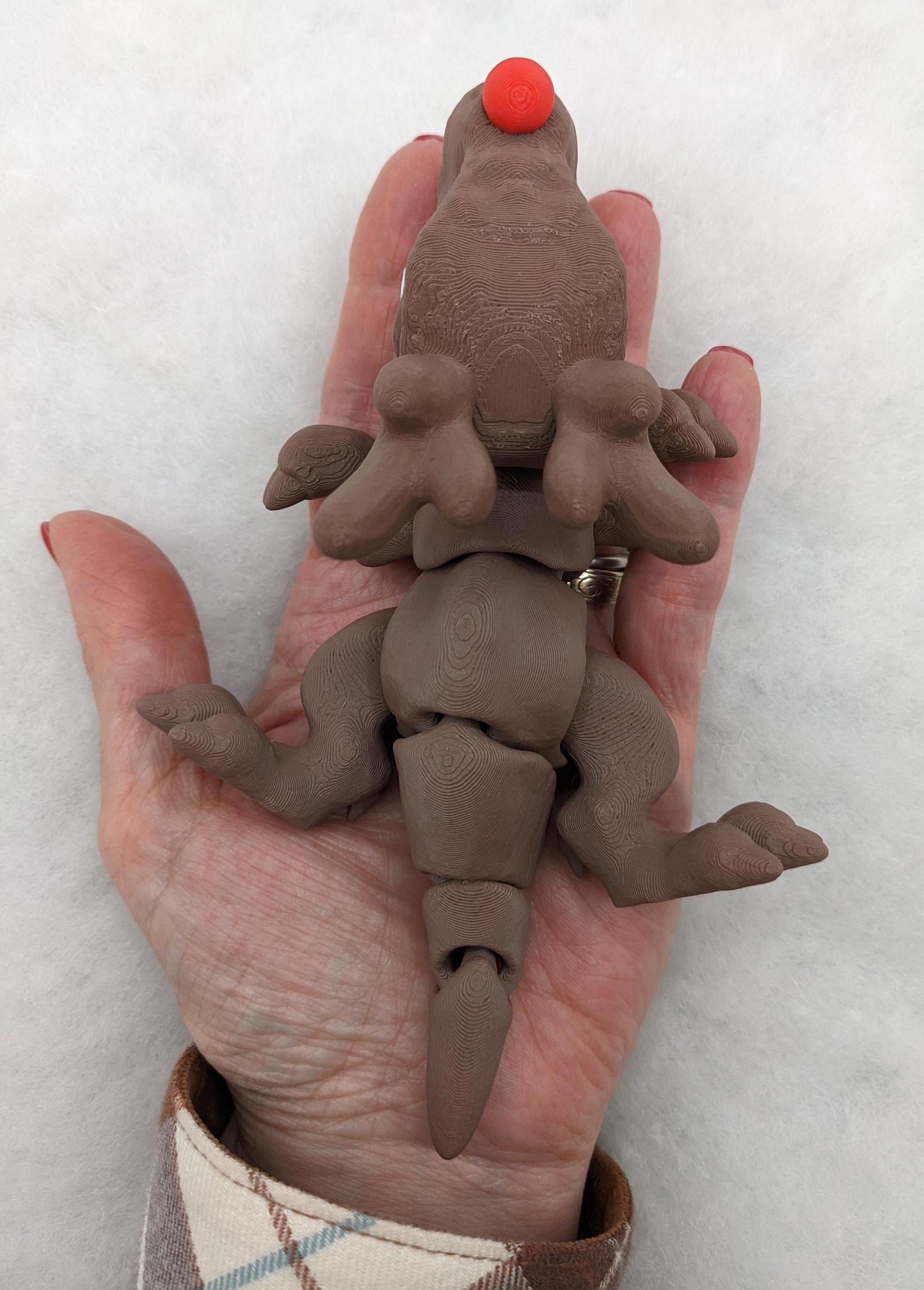 Our Christmas T-Rex combines the charm of Christmas with the fun of dinosaurs. An interactive toy for kids & adults alike,  articulated joints for posing & fidgeting, T-Rex is perfect as a stocking stuffer, desk toy, or playful holiday decoration.